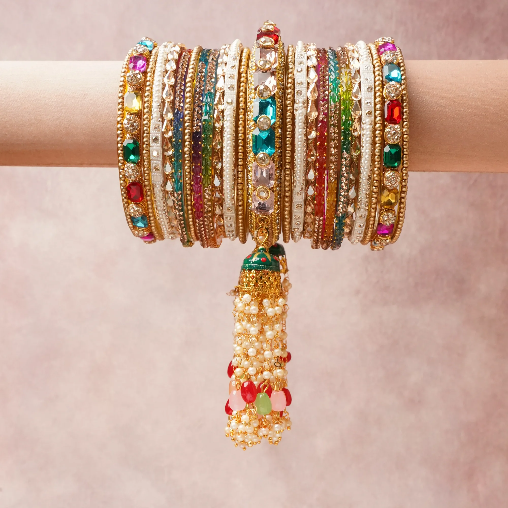 The Femminari Crown- Jewellery beyond luxury. A crown colour Gold set, complemented by Ruby Red, Fuchsia Pink, Emerald Green, Citrine Yellow, Champagne, Clear Crystal, Pearl White, Peach, Mint Green, Brick Orange, featuring Gold-toned Metal, Faceted Glass, Cubic Zirconia, Imitation Pearls, Enamel, Polished Resin, Colored Glass (bangles). A treat for the eyes, hands and heart- absolutely unforgettable.