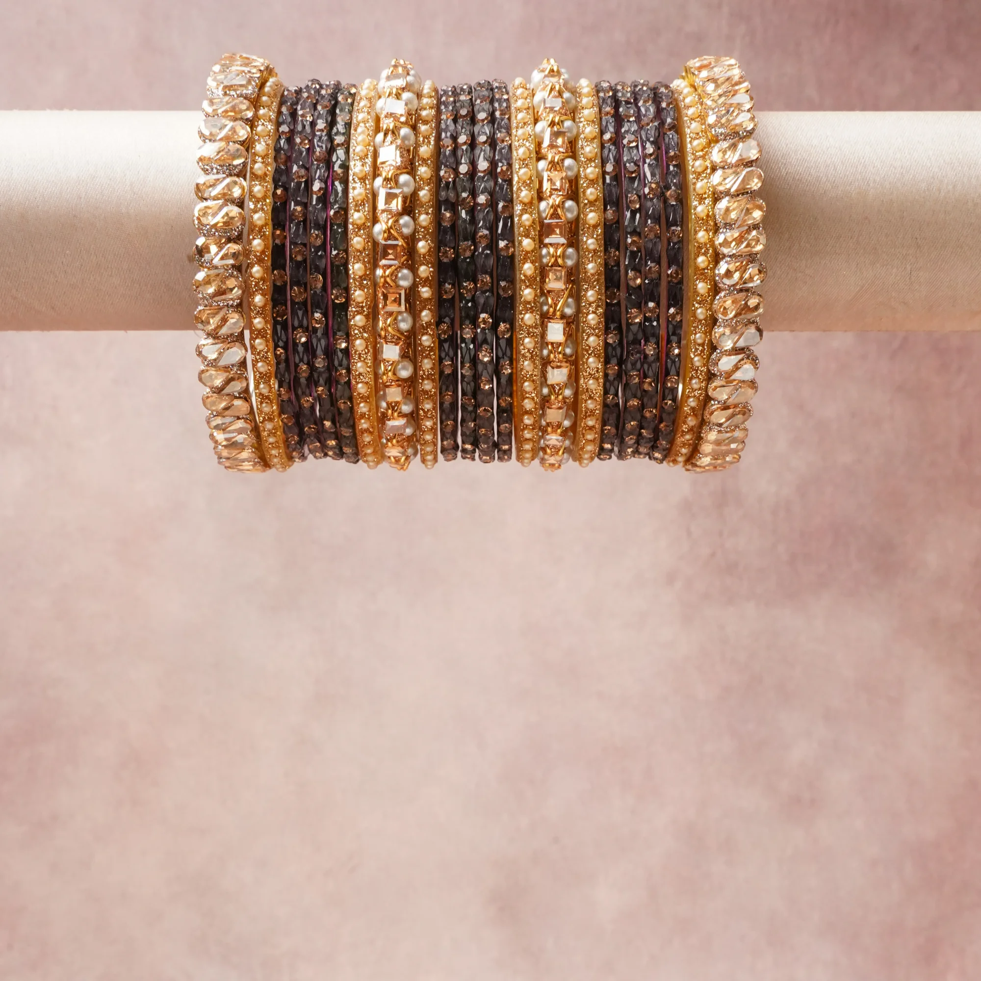 A grounding Black forms the heart of the set, while touches of Amber, Champagne, Cream add charm.

A thoughtful composition of Gold-toned Alloy, Faceted Glass, Imitation Pearls, designed to feel complete without being heavy.
Each element layers seamlessly, creating a look that is refined, wearable and quietly striking.