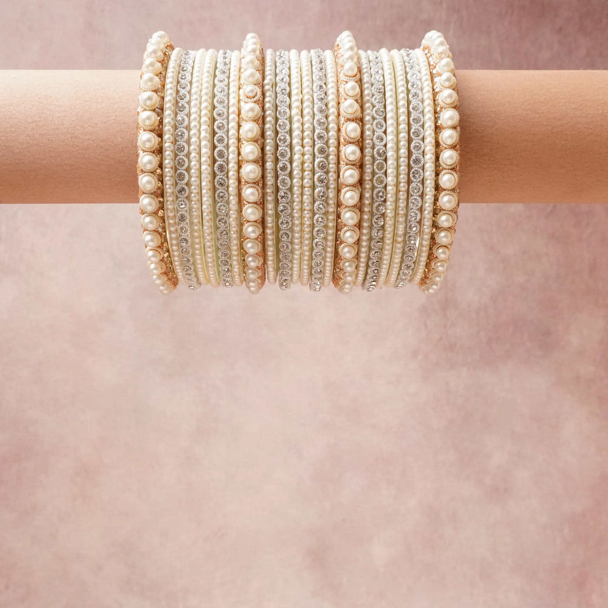 A grounding Cream White forms the heart of the set, while touches of Rose Gold, Silver, Iridescent Pearl add charm.

A thoughtful composition of Simulated Pearls, Rhinestones, Gold-toned Metal, Silver-toned Metal, designed to feel complete without being heavy.
Each element layers seamlessly, creating a look that is refined, wearable and quietly striking.