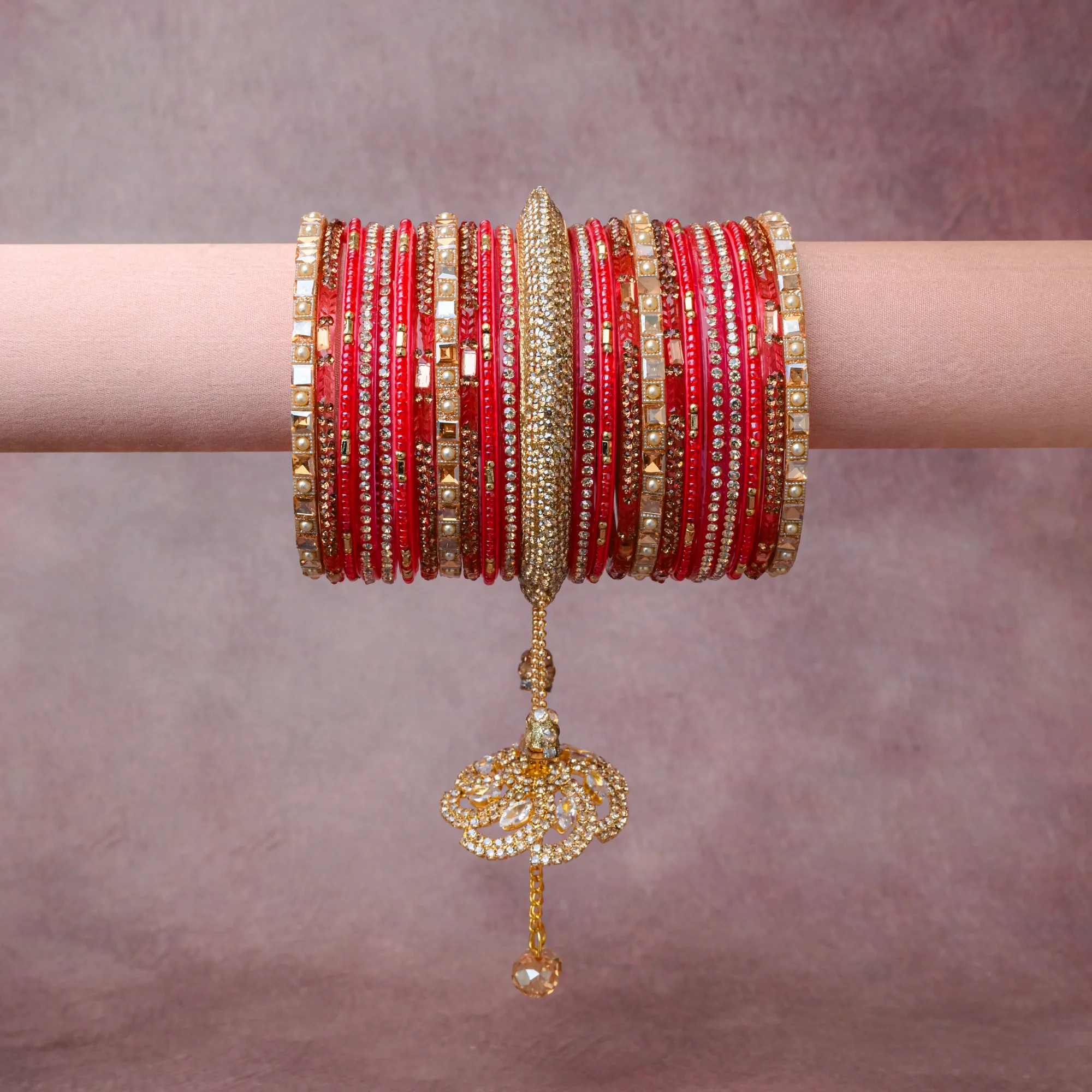 A grounding Deep Scarlet Red forms the heart of the set, while touches of Brilliant Clear, Champagne Peach, Cream Pearl add charm.

A thoughtful composition of Glass, Gold-plated Metal Alloy, Crystal Rhinestones, Faux Pearls, Faceted Crystal, designed to feel complete without being heavy.
Each element layers seamlessly, creating a look that is refined, wearable and quietly striking.