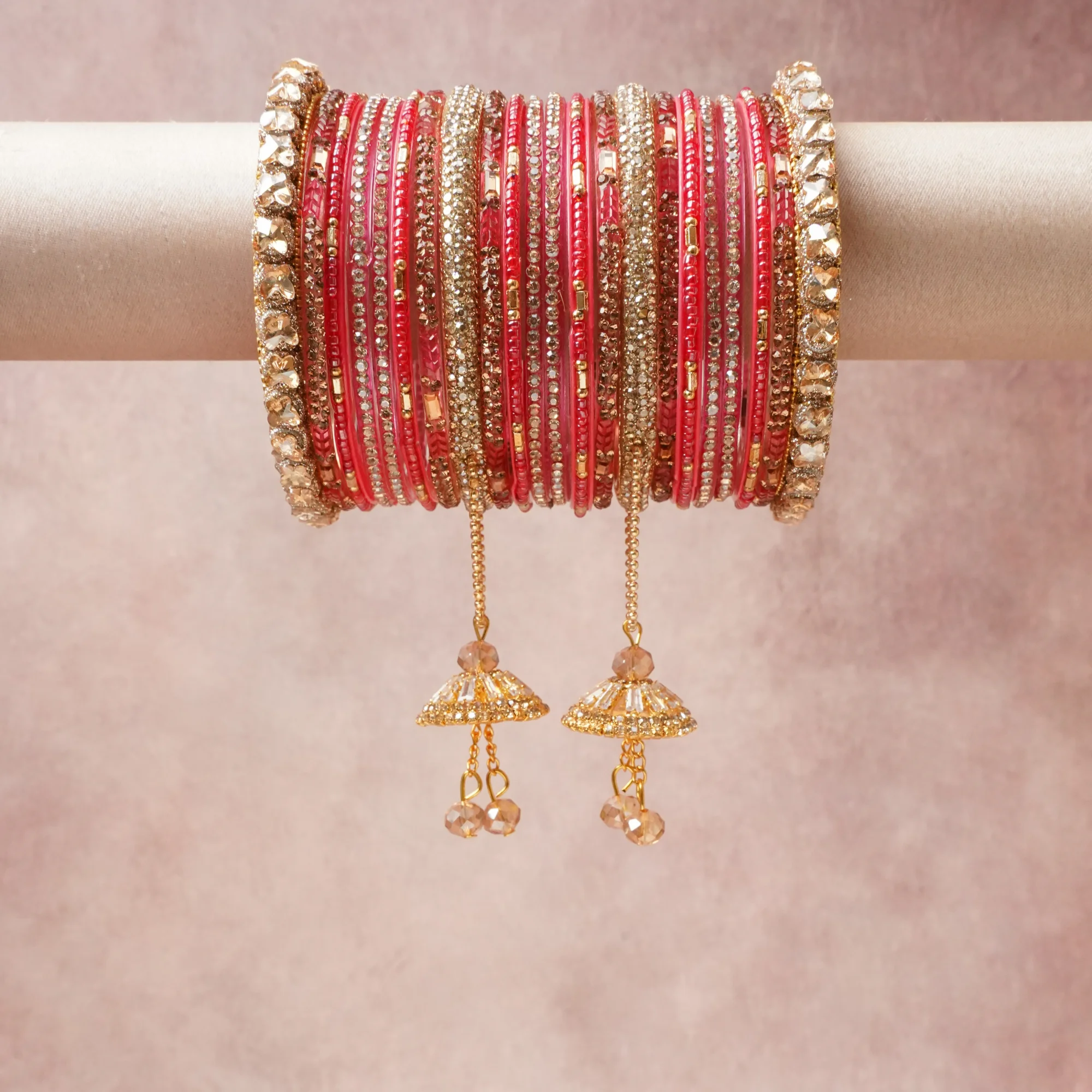 A grounding Vibrant Red forms the heart of the set, while touches of Glistening Gold, Clear Faceted Crystal, Champagne Faceted Crystal add charm.

A thoughtful composition of Glass, Gold-Plated Base Metal, Cubic Zirconia, Faceted Glass Beads, designed to feel complete without being heavy.
Each element layers seamlessly, creating a look that is refined, wearable and quietly striking.