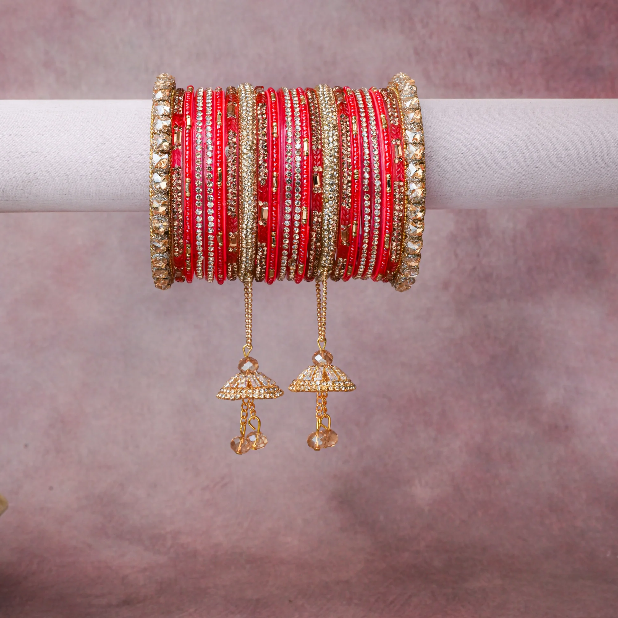 A grounding Vibrant Red forms the heart of the set, while touches of Glistening Gold, Clear Faceted Crystal, Champagne Faceted Crystal add charm.

A thoughtful composition of Glass, Gold-Plated Base Metal, Cubic Zirconia, Faceted Glass Beads, designed to feel complete without being heavy.
Each element layers seamlessly, creating a look that is refined, wearable and quietly striking.