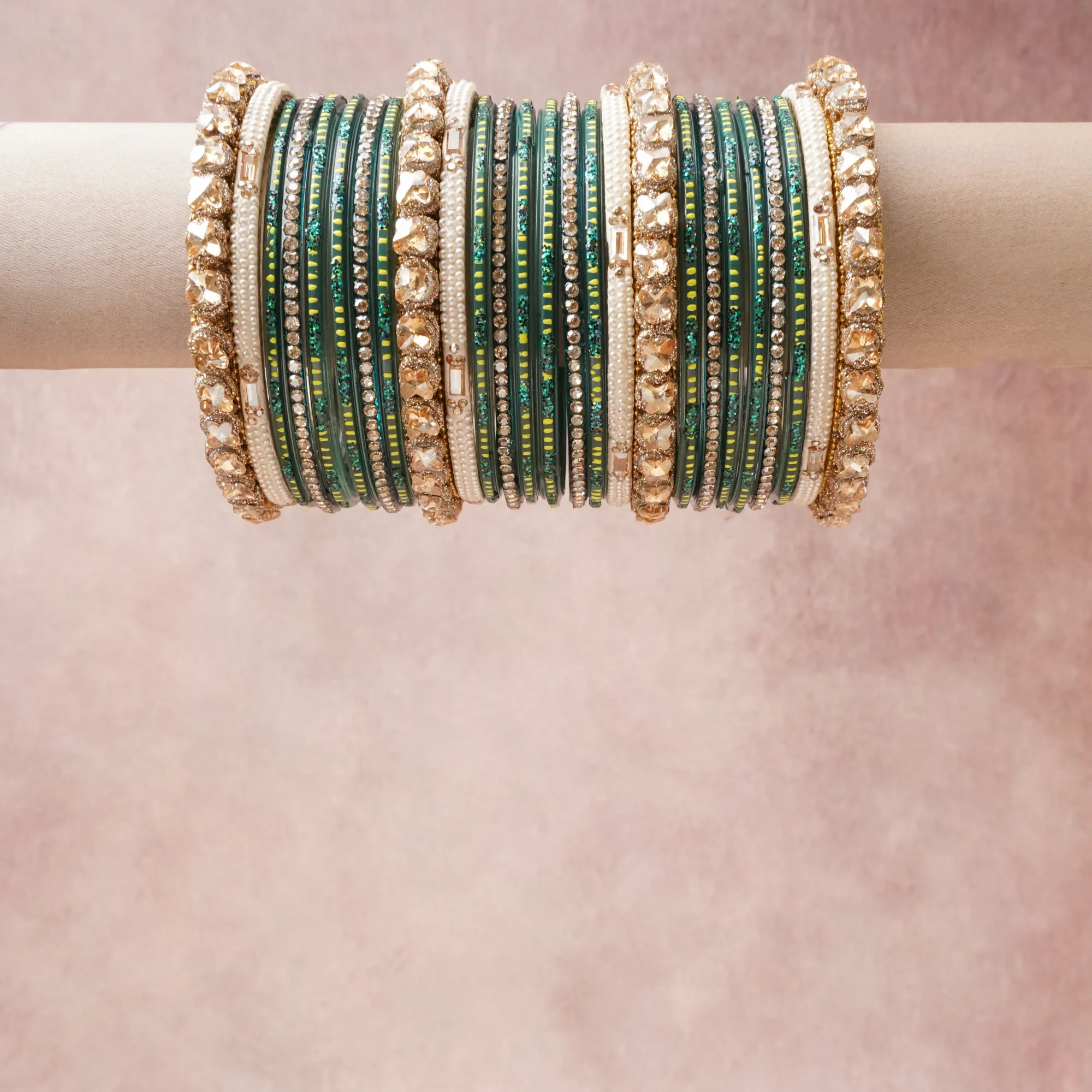 A grounding Deep Emerald Green forms the heart of the set, while touches of Champagne Gold, Clear Crystal, Pearlescent White, Lime Green, Metallic Gold add charm.

A thoughtful composition of Glass, Faceted Glass Crystals, Crystal Rhinestones, Imitation Pearls, Gold-Toned Base Metal, Lacquer/Enamel, Silk Thread, designed to feel complete without being heavy.
Each element layers seamlessly, creating a look that is refined, wearable and quietly striking.