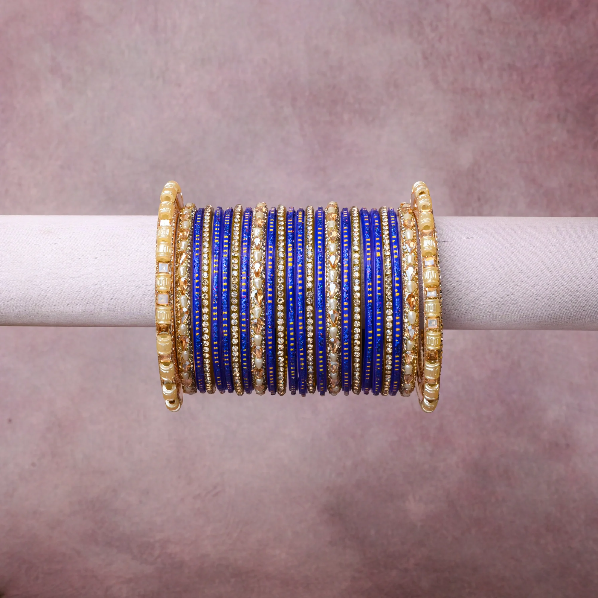 A grounding Cobalt Blue forms the heart of the set, while touches of Clear Crystal, Ivory Pearl, Saffron Yellow add charm.

A thoughtful composition of Glass, Gold-Toned Metal Alloy, Rhinestone, Imitation Pearl, Acrylic Crystal, designed to feel complete without being heavy.
Each element layers seamlessly, creating a look that is refined, wearable and quietly striking.