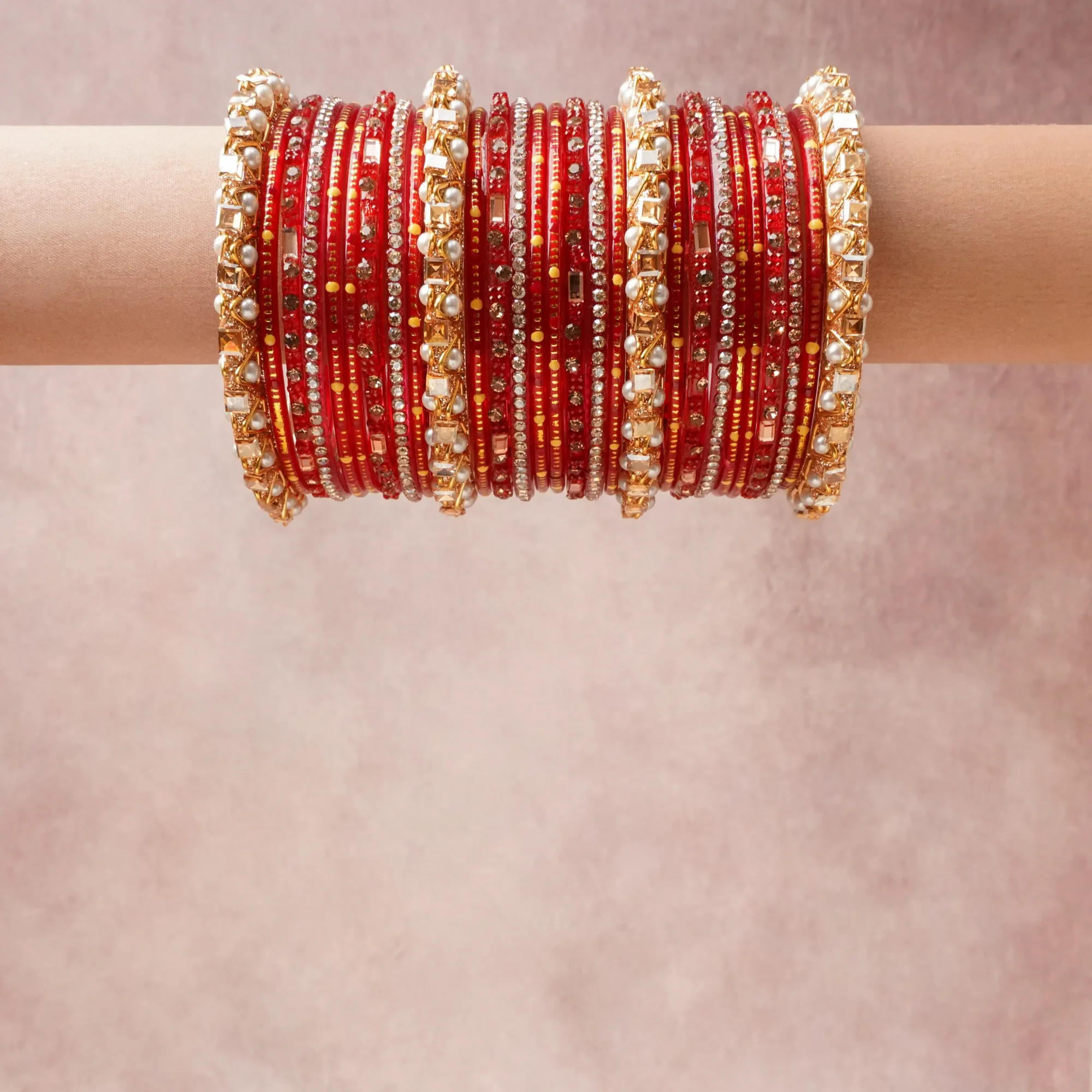 A grounding Crimson Red forms the heart of the set, while touches of Gold, Pearl White add charm.

A thoughtful composition of Glass, Gold-Toned Metal, Simulated Pearl, Crystals, designed to feel complete without being heavy.
Each element layers seamlessly, creating a look that is refined, wearable and quietly striking.