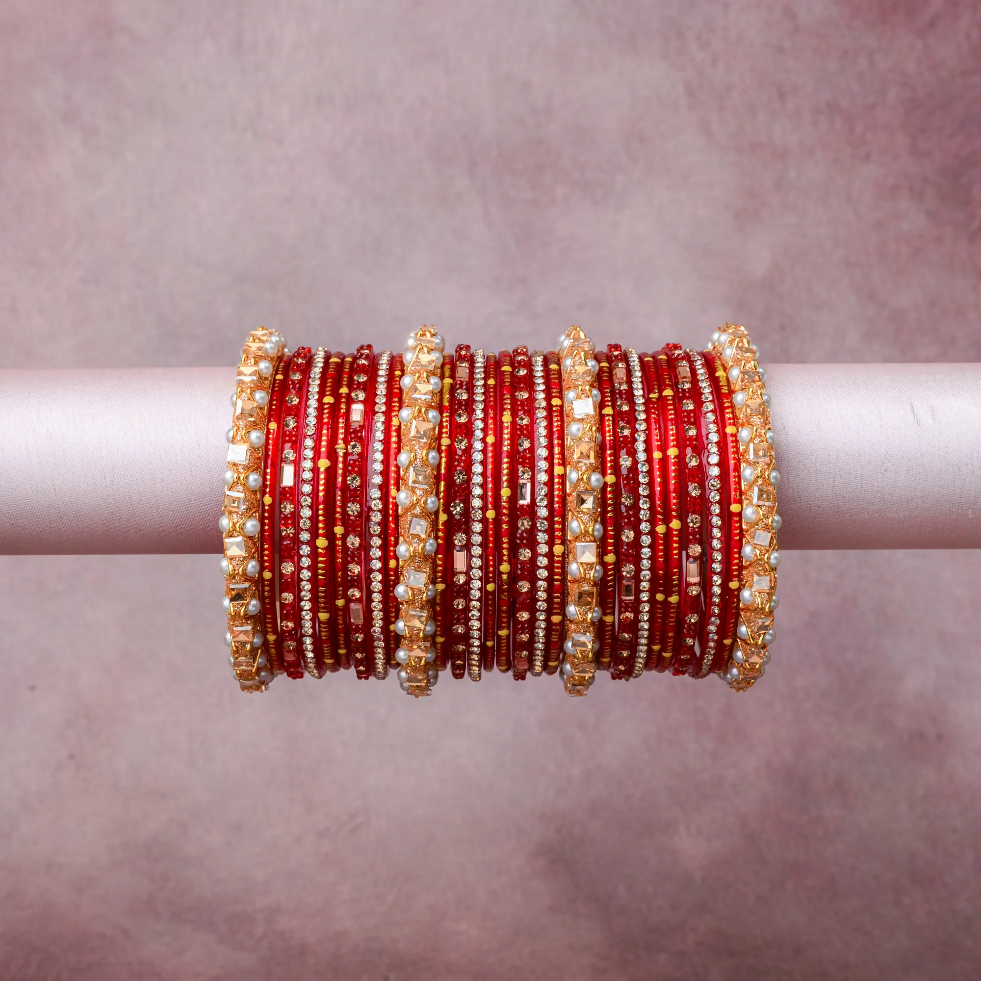A grounding Crimson Red forms the heart of the set, while touches of Gold, Pearl White add charm.

A thoughtful composition of Glass, Gold-Toned Metal, Simulated Pearl, Crystals, designed to feel complete without being heavy.
Each element layers seamlessly, creating a look that is refined, wearable and quietly striking.