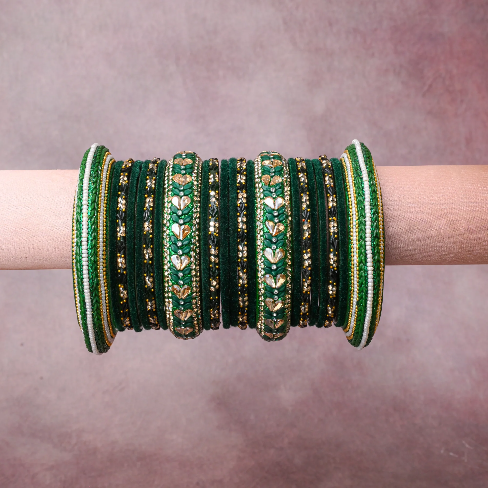 A grounding Deep Forest Green forms the heart of the set, while touches of Gold, Clear, White, Light Emerald Green, Champagne, Black add charm.

A thoughtful composition of Velvet, Gold-toned Metal, Glass Rhinestones, Enamel, Glass Beads, Textile Thread, designed to feel complete without being heavy.
Each element layers seamlessly, creating a look that is refined, wearable and quietly striking.