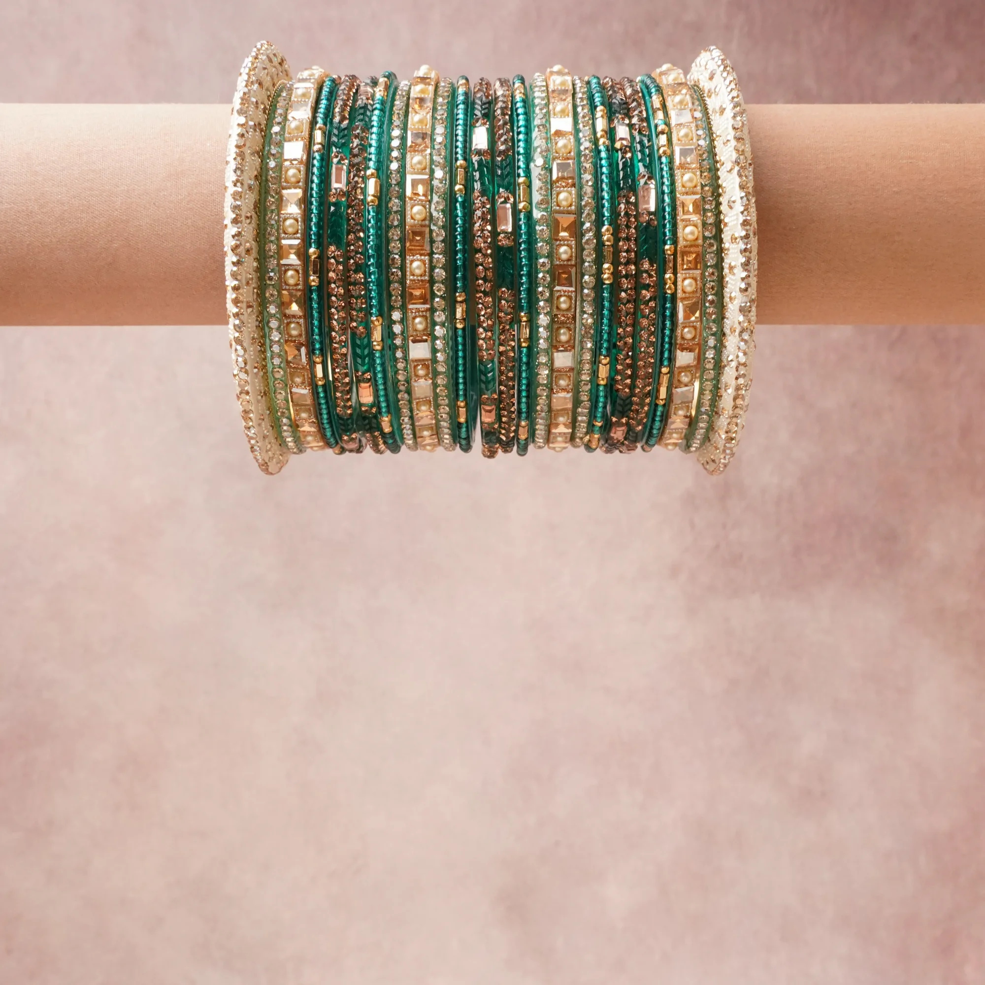A grounding Emerald Green forms the heart of the set, while touches of Gold, Pearl White, Crystal Clear add charm.

A thoughtful composition of Metal Alloy, Crystals, Faux Pearls, Enamel, designed to feel complete without being heavy.
Each element layers seamlessly, creating a look that is refined, wearable and quietly striking.