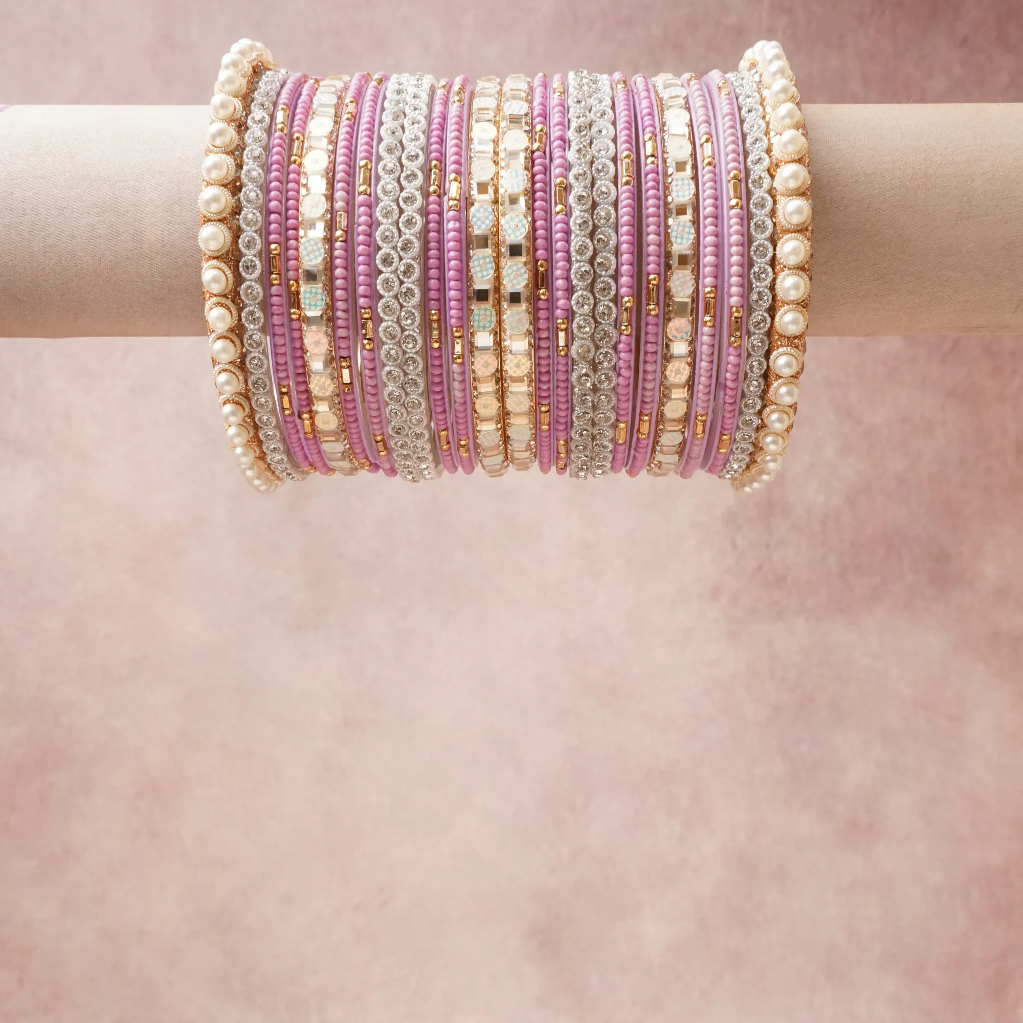 A grounding Orchid Pink forms the heart of the set, while touches of Pearlescent White, Silver, Gold, Pastel Blue, Pale Peach add charm.

A thoughtful composition of Glass, Rhinestones, Simulated Pearls, Gold-Toned Metal, Silver-Toned Metal, Enamel/Resin, designed to feel complete without being heavy.
Each element layers seamlessly, creating a look that is refined, wearable and quietly striking.