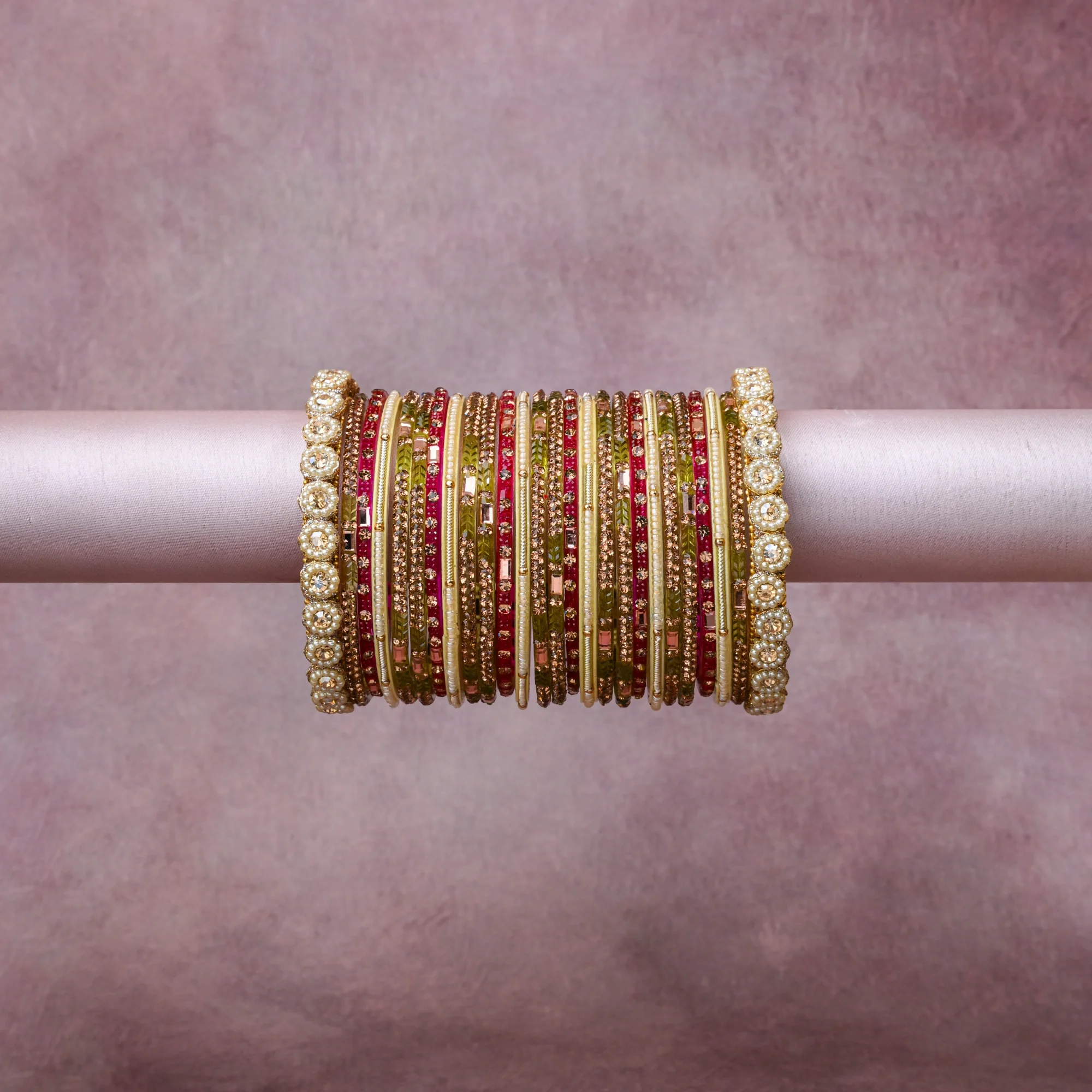 A grounding Gold forms the heart of the set, while touches of Pearlescent White and Red add charm.

A thoughtful composition of Gold-plated Metal, Glass, Faux Pearls, Rhinestones, Silk Thread, designed to feel complete without being heavy.
Each element layers seamlessly, creating a look that is refined, wearable and quietly striking.