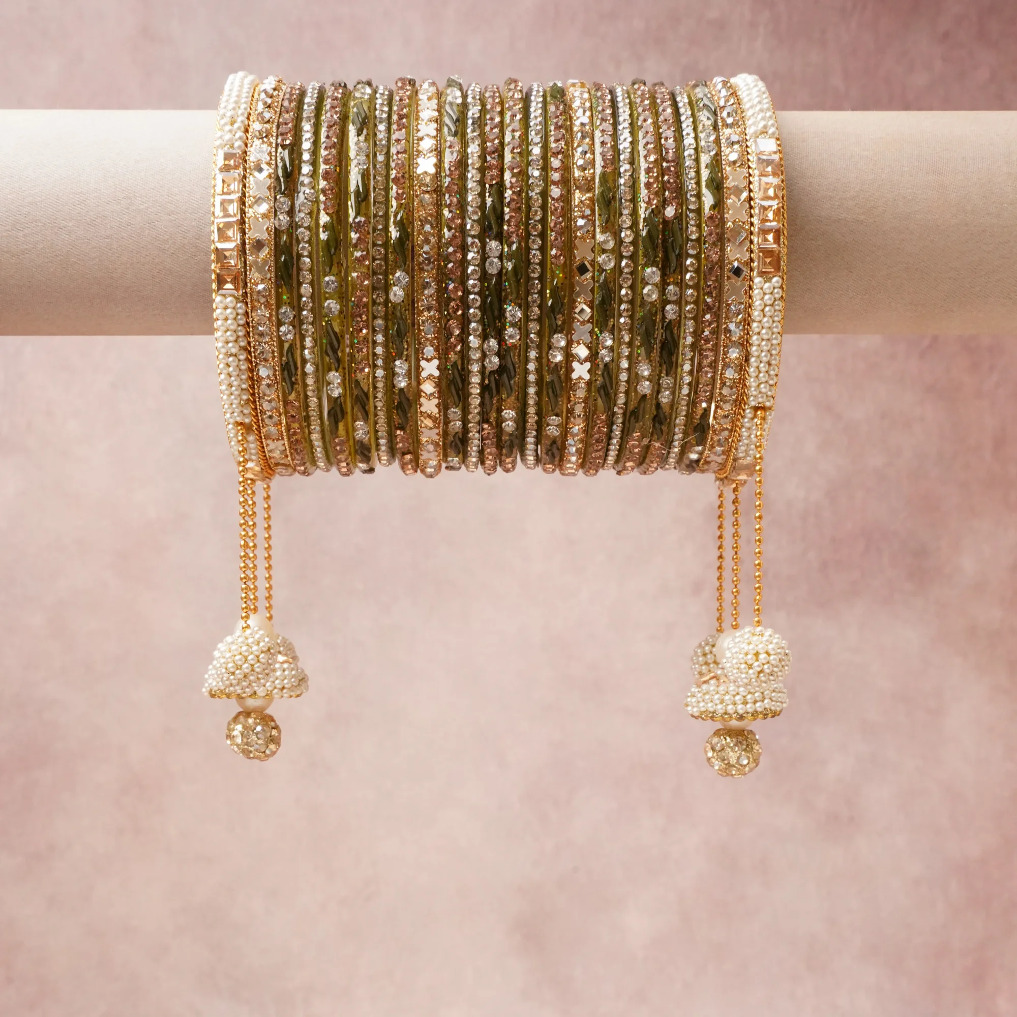 A grounding Olive Green forms the heart of the set, while touches of Gold, Clear Crystal, Cream, Rose Gold add charm.

A thoughtful composition of Glass, Metal Alloy, Faux Pearls, Rhinestones, Mirror Inlays, designed to feel complete without being heavy.
Each element layers seamlessly, creating a look that is refined, wearable and quietly striking.