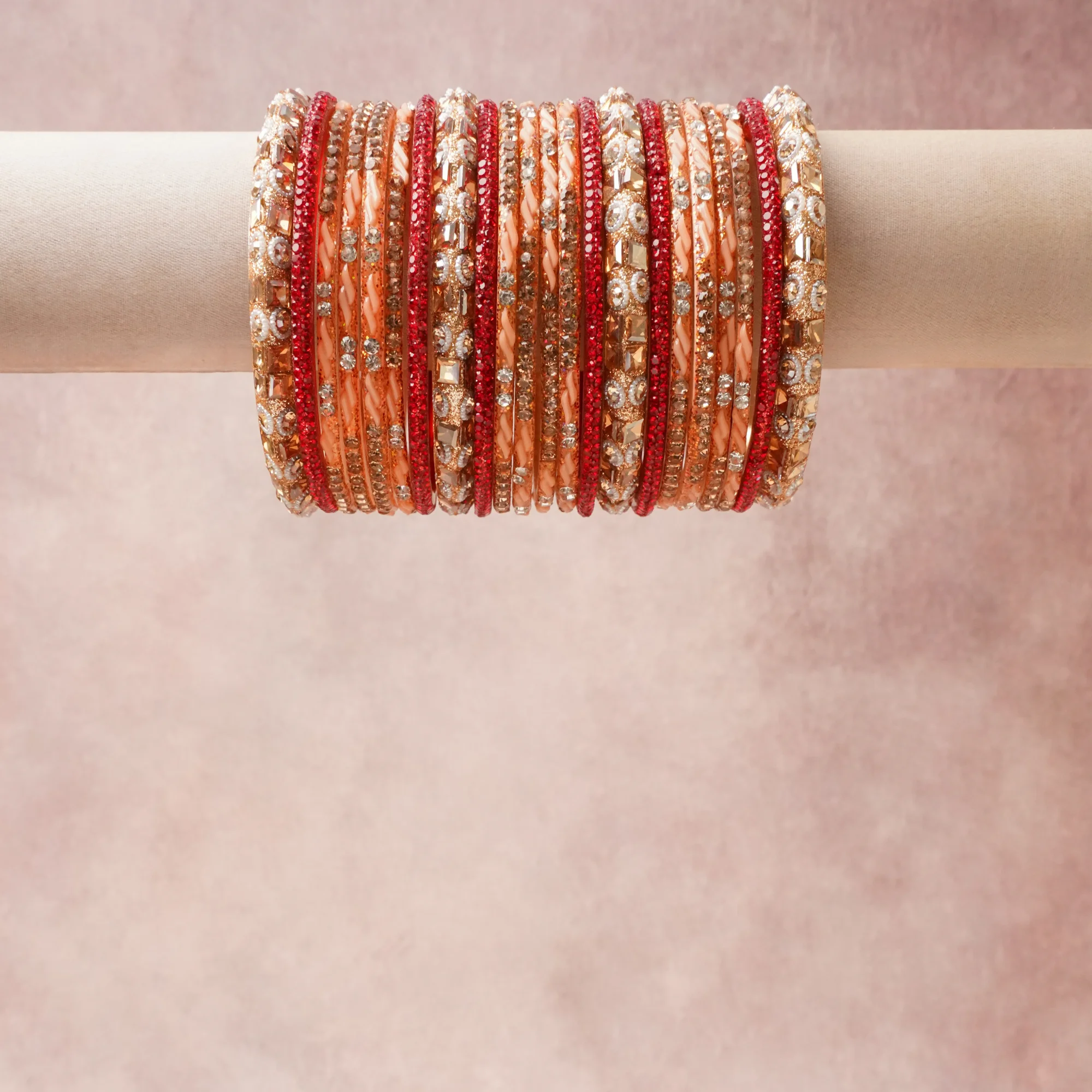A grounding Peach forms the heart of the set, while touches of Vibrant Red, Clear Crystal, Champagne Gold, Cream add charm.

A thoughtful composition of Metal Alloy (Gold-toned), Glass Rhinestones, Glitter Embellishment, Silk Thread, Lacquer/Resin, designed to feel complete without being heavy.
Each element layers seamlessly, creating a look that is refined, wearable and quietly striking.