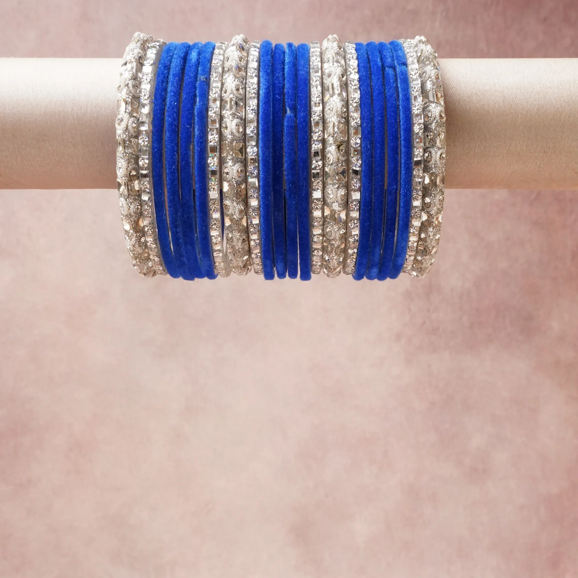 A grounding Royal Blue forms the heart of the set, while touches of Brilliant White, Luminous Silver add charm.

A thoughtful composition of Velvet, Silver-toned Metal, Crystals, designed to feel complete without being heavy.
Each element layers seamlessly, creating a look that is refined, wearable and quietly striking.