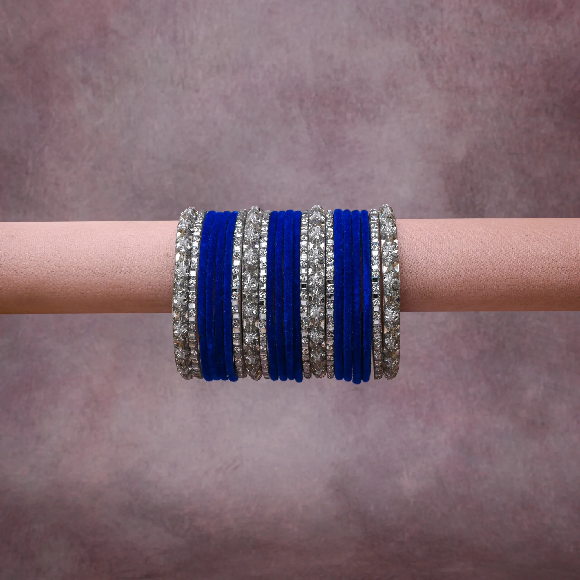 A grounding Royal Blue forms the heart of the set, while touches of Brilliant White, Luminous Silver add charm.

A thoughtful composition of Velvet, Silver-toned Metal, Crystals, designed to feel complete without being heavy.
Each element layers seamlessly, creating a look that is refined, wearable and quietly striking.