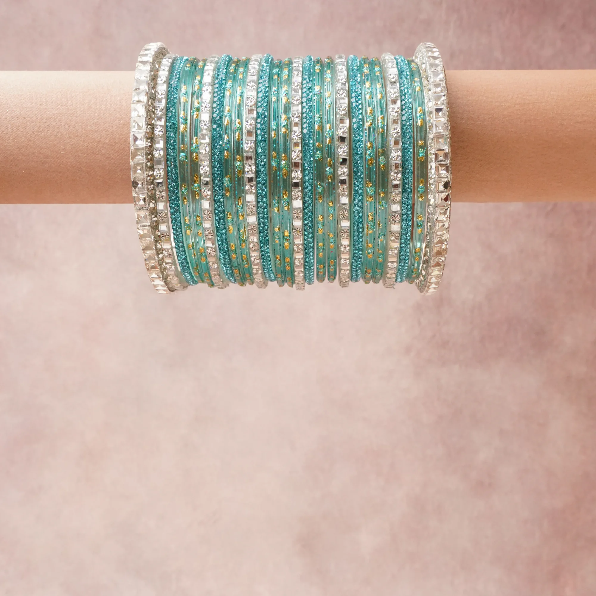 A grounding Teal forms the heart of the set, while touches of Clear, Silver, Gold add charm.

A thoughtful composition of Glass, Metal Alloy, Crystals, designed to feel complete without being heavy.
Each element layers seamlessly, creating a look that is refined, wearable and quietly striking.