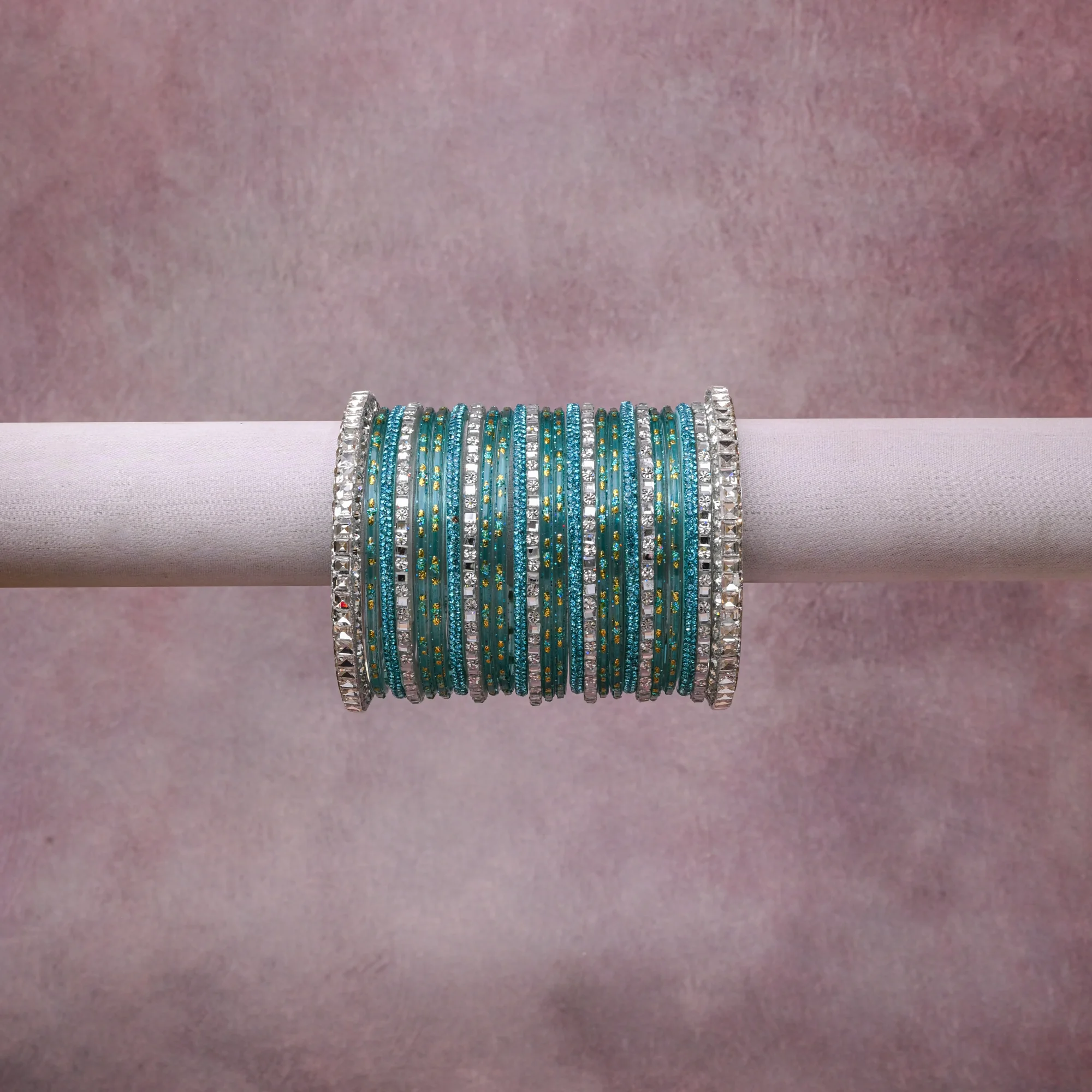 A grounding Teal forms the heart of the set, while touches of Clear, Silver, Gold add charm.

A thoughtful composition of Glass, Metal Alloy, Crystals, designed to feel complete without being heavy.
Each element layers seamlessly, creating a look that is refined, wearable and quietly striking.