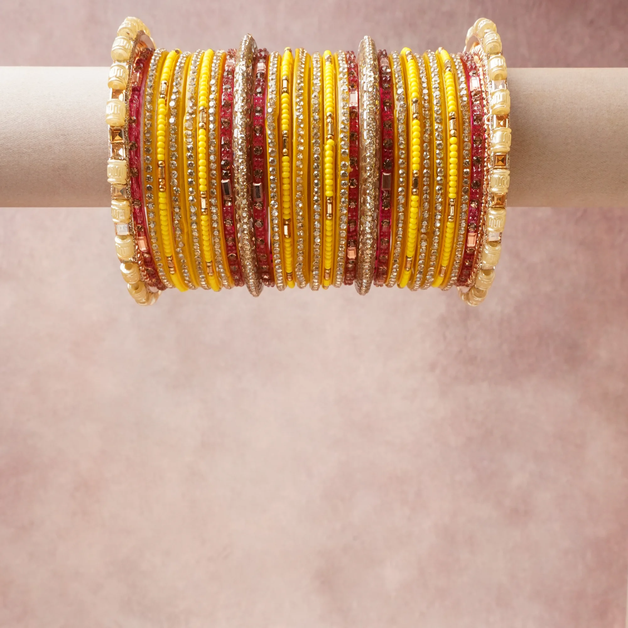 A grounding Vibrant Yellow forms the heart of the set, while touches of Glistening Gold, Brilliant Clear, Opaque White add charm.

A thoughtful composition of Glass, Gold-toned Metal Alloy, Crystal Rhinestones, Glass Seed Beads, designed to feel complete without being heavy.
Each element layers seamlessly, creating a look that is refined, wearable and quietly striking.
