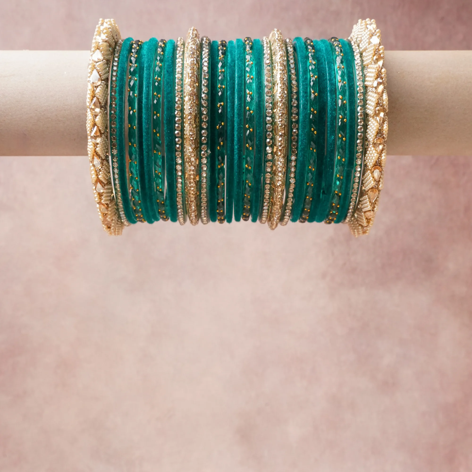 A grounding Teal forms the heart of the set, while touches of Ivory, Clear, Champagne add charm.

A thoughtful composition of Glass, Velvet, Simulated Pearls, Crystals, Base Metal Alloy, Rose Gold Plating, designed to feel complete without being heavy.
Each element layers seamlessly, creating a look that is refined, wearable and quietly striking.