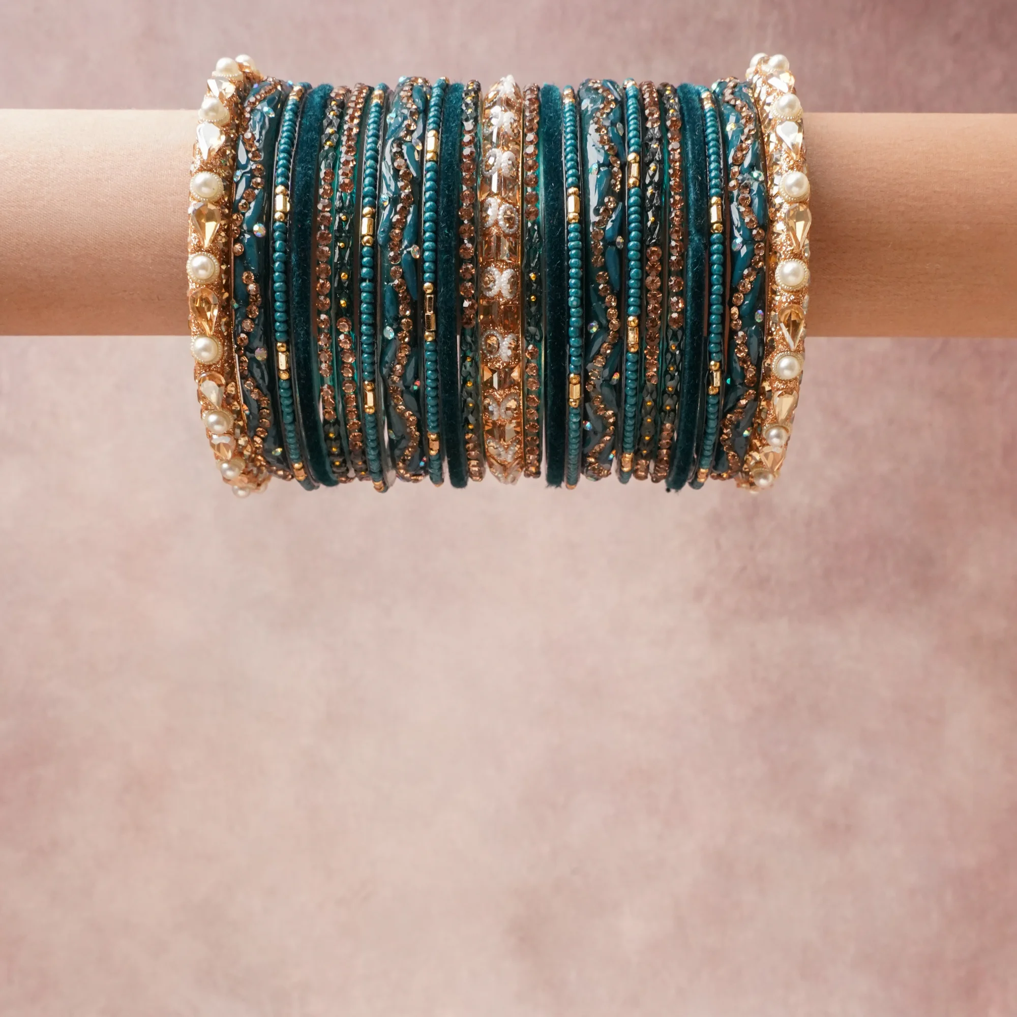 A grounding Deep Teal forms the heart of the set, while touches of Rose Gold, Champagne, Pearl White add charm.

A thoughtful composition of Gold-plated Metal, Crystal, Faux Pearls, Velvet, Glass Beads, Lacquer/Resin, designed to feel complete without being heavy.
Each element layers seamlessly, creating a look that is refined, wearable and quietly striking.