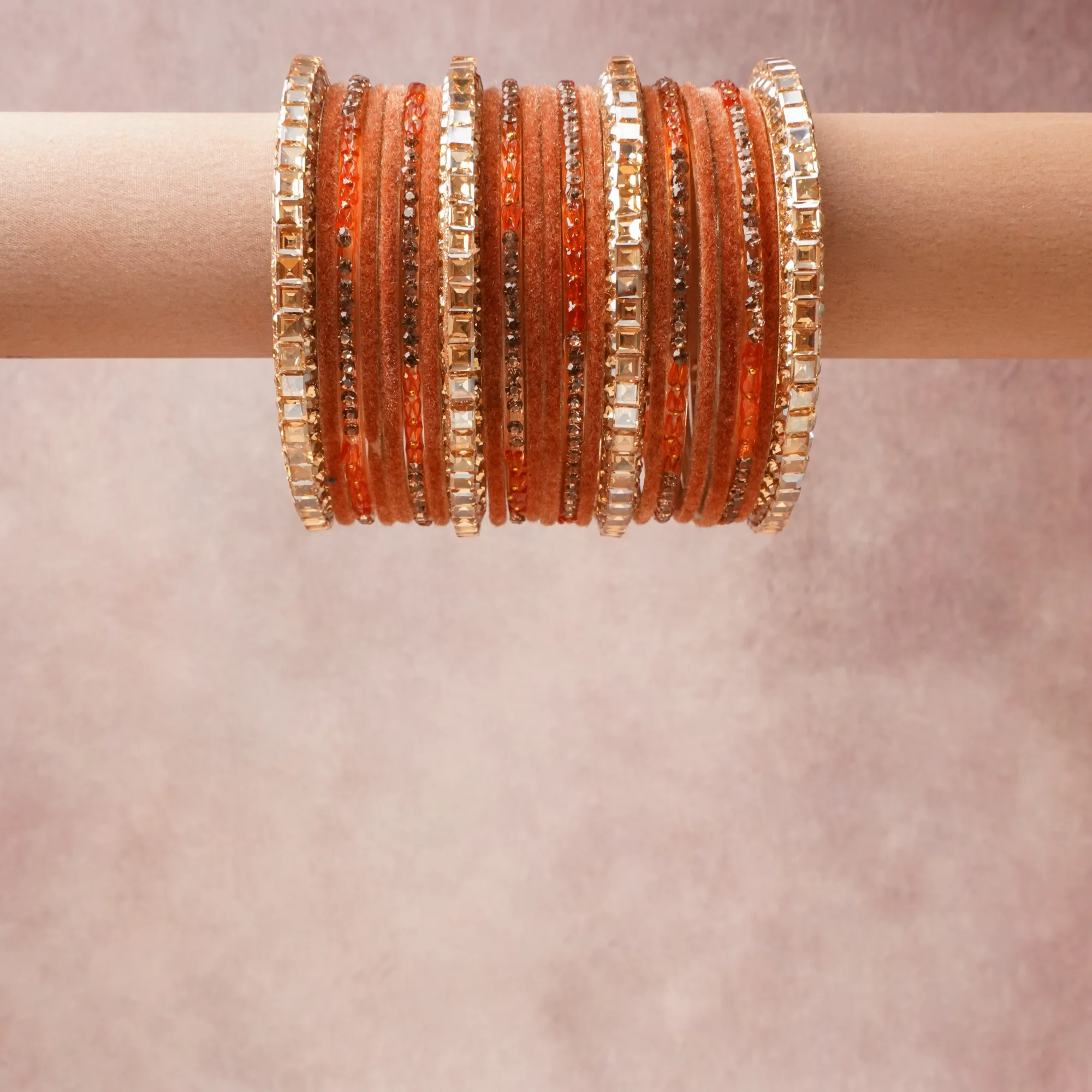 A grounding Burnished Terracotta forms the heart of the set, while touches of Champagne Faceted Crystal, Clear Micro-pavé Crystal add charm.

A thoughtful composition of Velvet Fabric, Faceted Glass Crystals, Micro-pavé Glass Crystals, Gold-toned Metal Alloy, designed to feel complete without being heavy.
Each element layers seamlessly, creating a look that is refined, wearable and quietly striking.