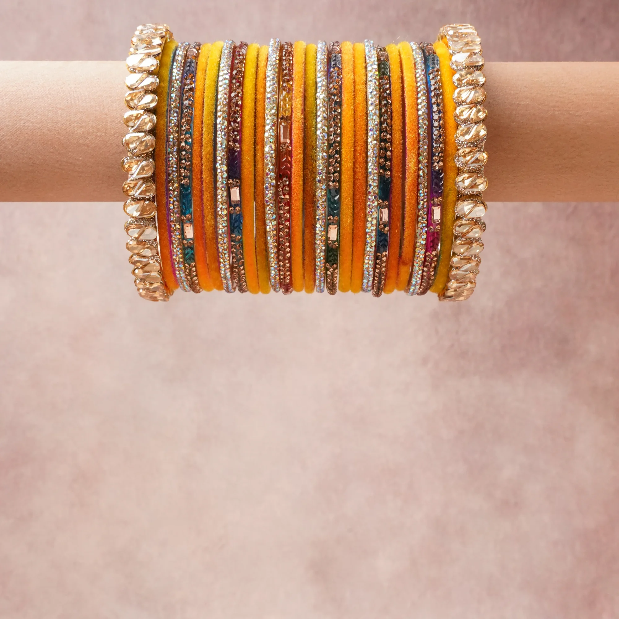 A grounding Marigold Yellow forms the heart of the set, while touches of Gold, Champagne, Iridescent, Ruby Red, Sapphire Blue, Emerald Green, Amethyst Purple, Rose Pink add charm.

A thoughtful composition of Gold-Tone Metal, Velvet Fabric, Faceted Glass Crystals, Glass Rhinestones, designed to feel complete without being heavy.
Each element layers seamlessly, creating a look that is refined, wearable and quietly striking.