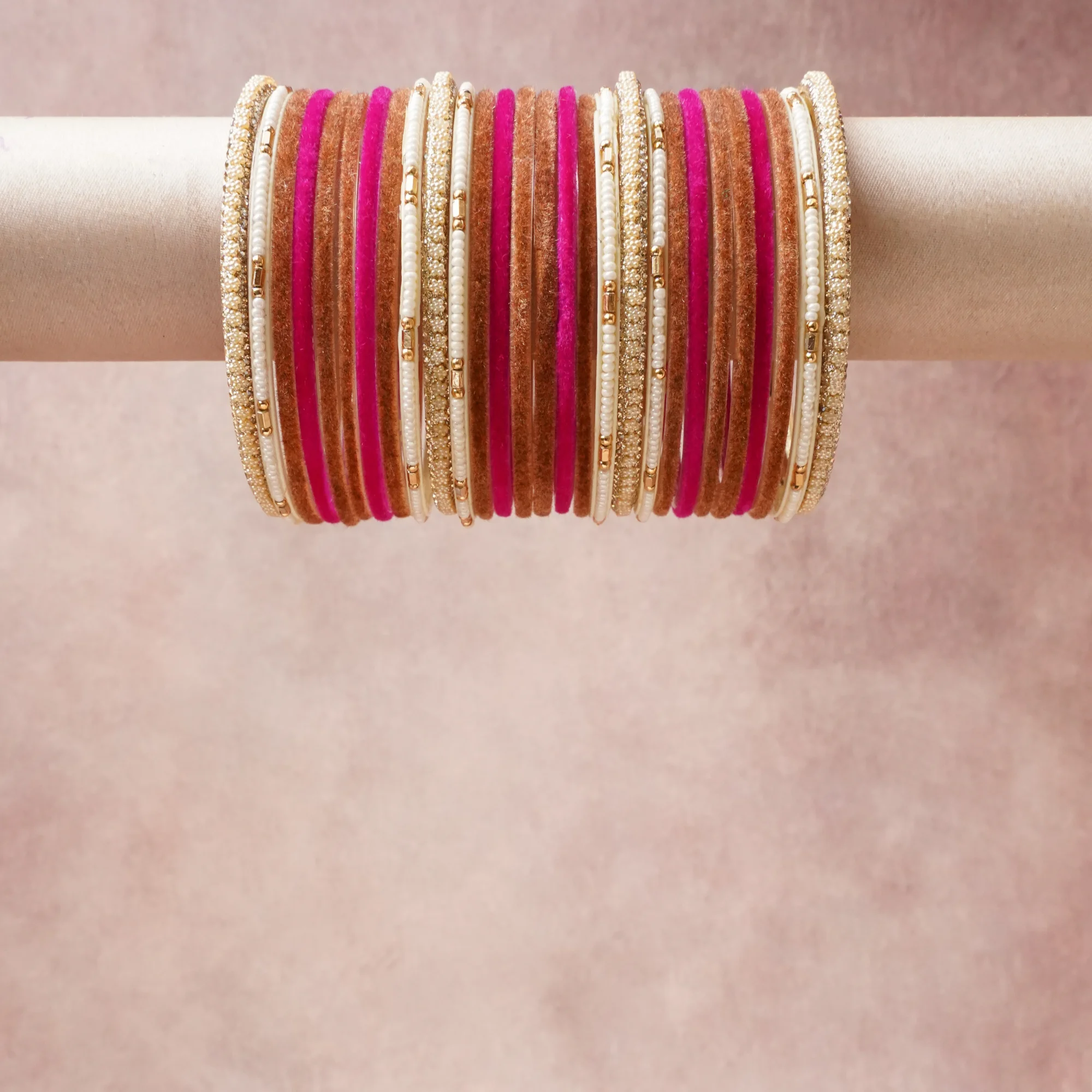 A grounding Fuchsia forms the heart of the set, while touches of Brilliant White, Iridescent White, Metallic Gold add charm.

A thoughtful composition of Velvet, Gold-toned Alloy, Cubic Zirconia, Faux Pearl, Metal Beads, designed to feel complete without being heavy.
Each element layers seamlessly, creating a look that is refined, wearable and quietly striking.