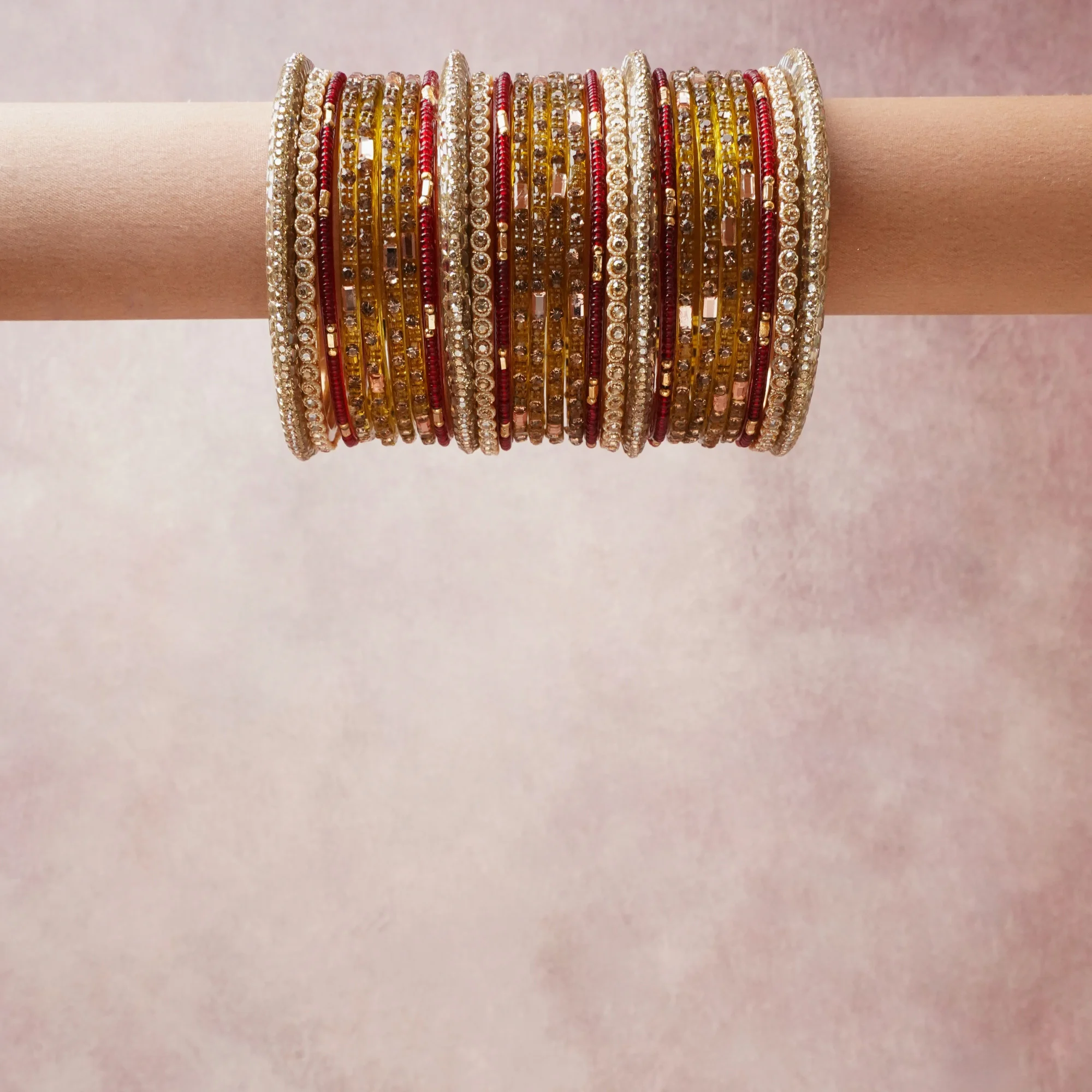 A grounding gold forms the heart of the set, while touches of ruby red, champagne, clear crystal add charm.

A thoughtful composition of metal, rhinestone, glass beads, designed to feel complete without being heavy.
Each element layers seamlessly, creating a look that is refined, wearable and quietly striking.