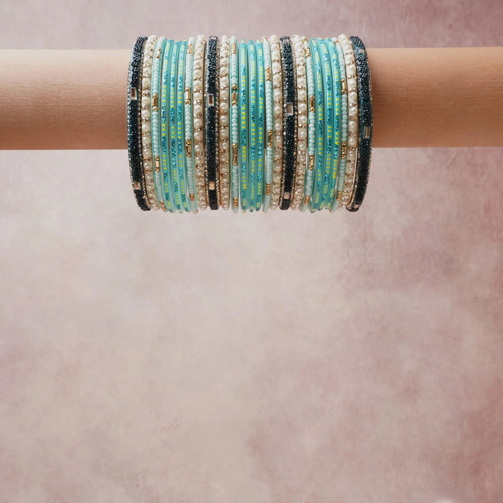 A grounding aqua forms the heart of the set, while touches of white, gold, navy blue add charm.

A thoughtful composition of glass beads, seed beads, metal accents, designed to feel complete without being heavy.
Each element layers seamlessly, creating a look that is refined, wearable and quietly striking.