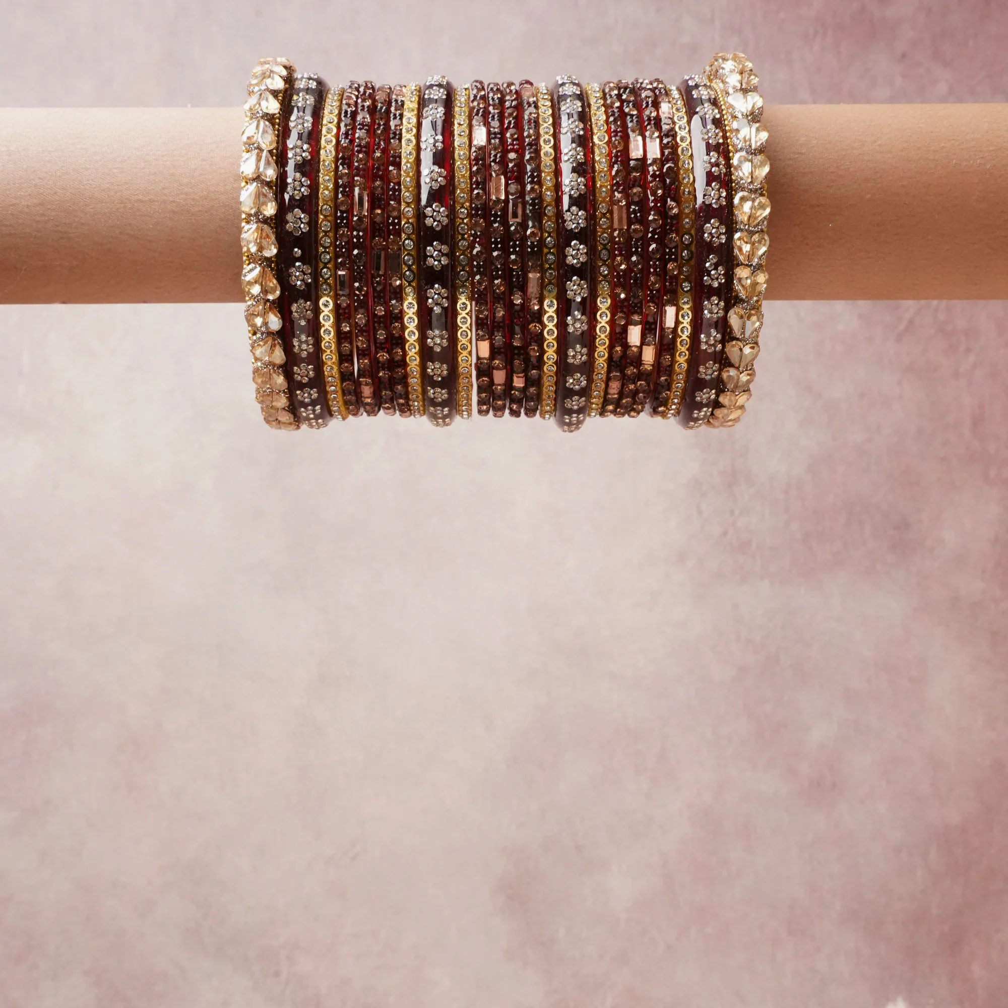 A grounding burgundy forms the heart of the set, while touches of gold add charm.

A thoughtful composition of metal, crystal, rhinestone, designed to feel complete without being heavy.
Each element layers seamlessly, creating a look that is refined, wearable and quietly striking.