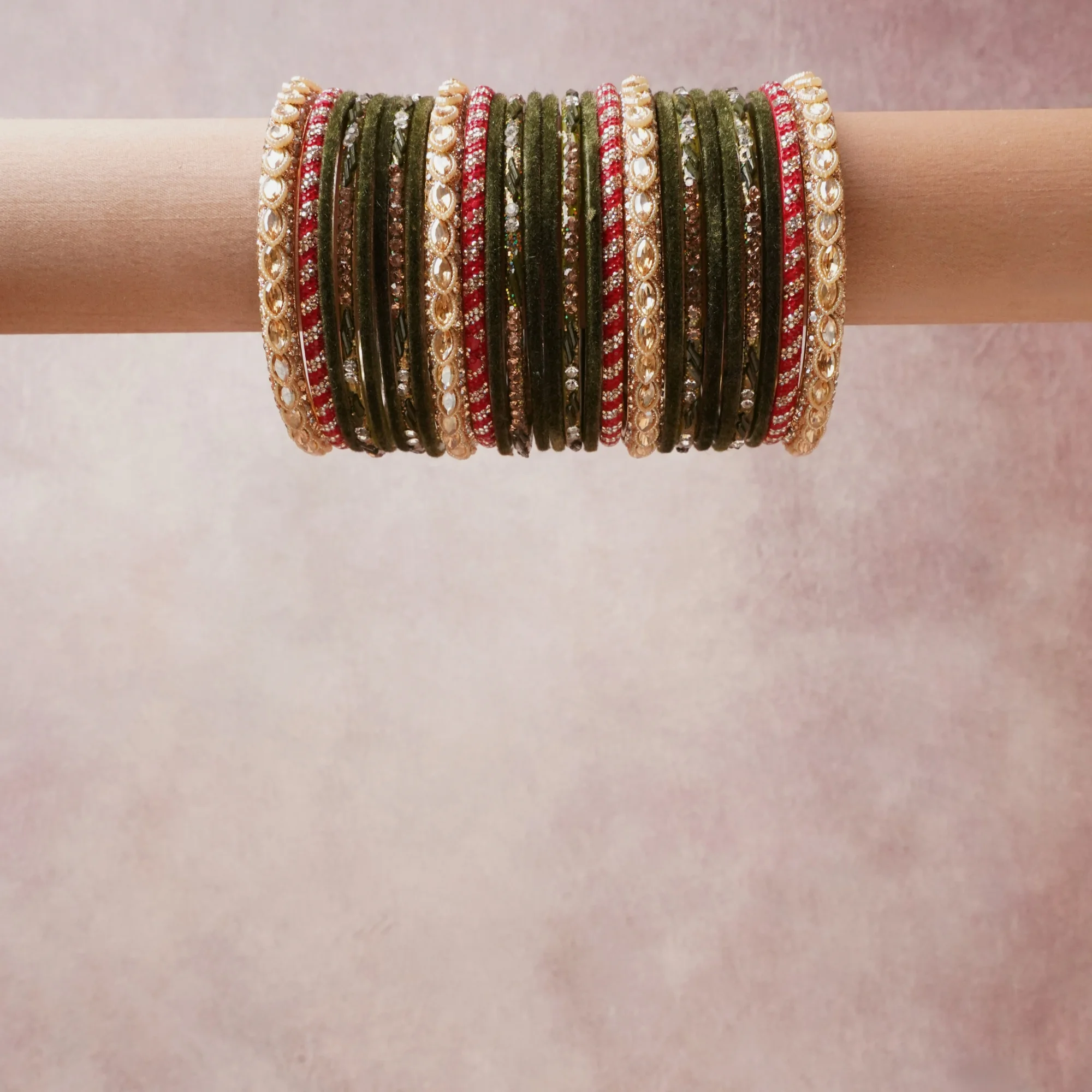 A grounding olive green forms the heart of the set, while touches of gold, red add charm.

A thoughtful composition of glass bangles, rhinestone, metal, designed to feel complete without being heavy.
Each element layers seamlessly, creating a look that is refined, wearable and quietly striking.