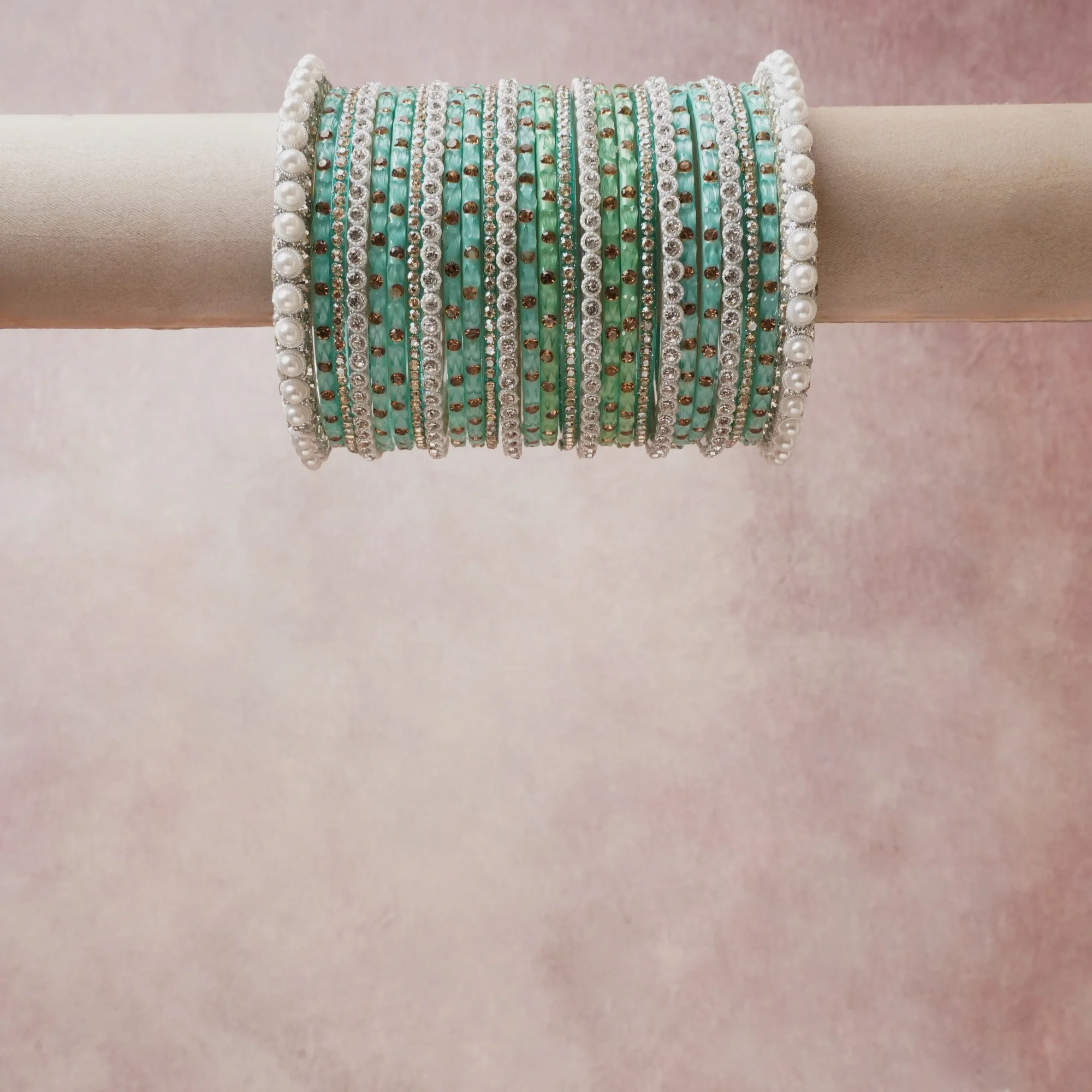A grounding Mint Green forms the heart of the set, while touches of White, Silver, Rose Gold add charm.

A thoughtful composition of Rhinestone, Pearls, Metal, designed to feel complete without being heavy.
Each element layers seamlessly, creating a look that is refined, wearable and quietly striking.