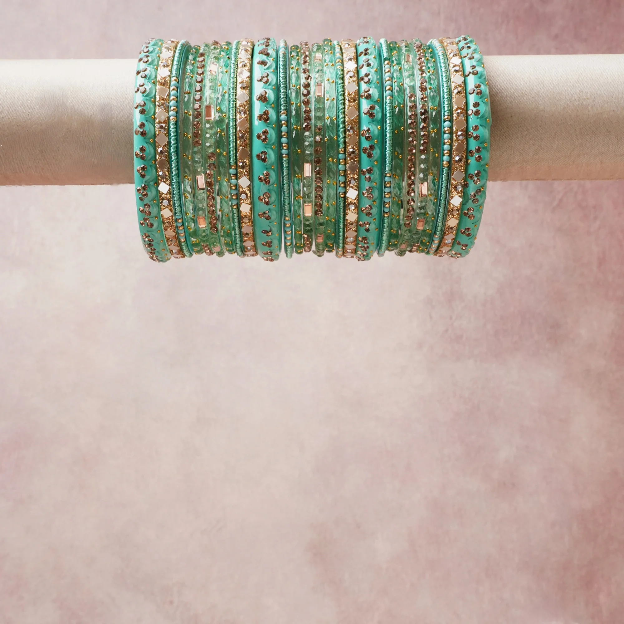 A grounding turquoise forms the heart of the set, while touches of gold, rose gold, clear add charm.

A thoughtful composition of glass, rhinestone, metal, designed to feel complete without being heavy.
Each element layers seamlessly, creating a look that is refined, wearable and quietly striking.