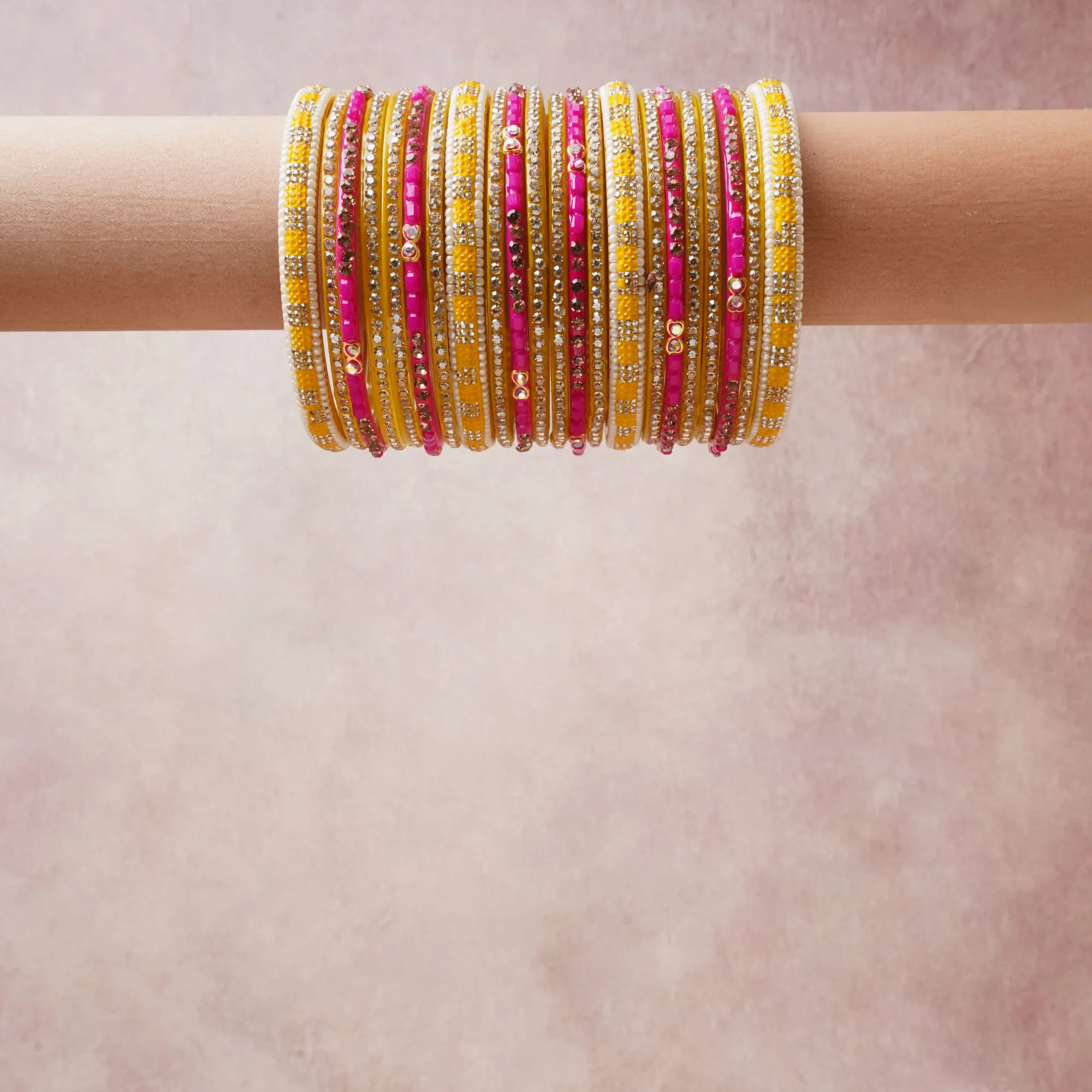 A grounding Gold forms the heart of the set, while touches of Hot Pink, White, Yellow add charm.

A thoughtful composition of Kundan, Glass Beads, Metal, designed to feel complete without being heavy.
Each element layers seamlessly, creating a look that is refined, wearable and quietly striking.