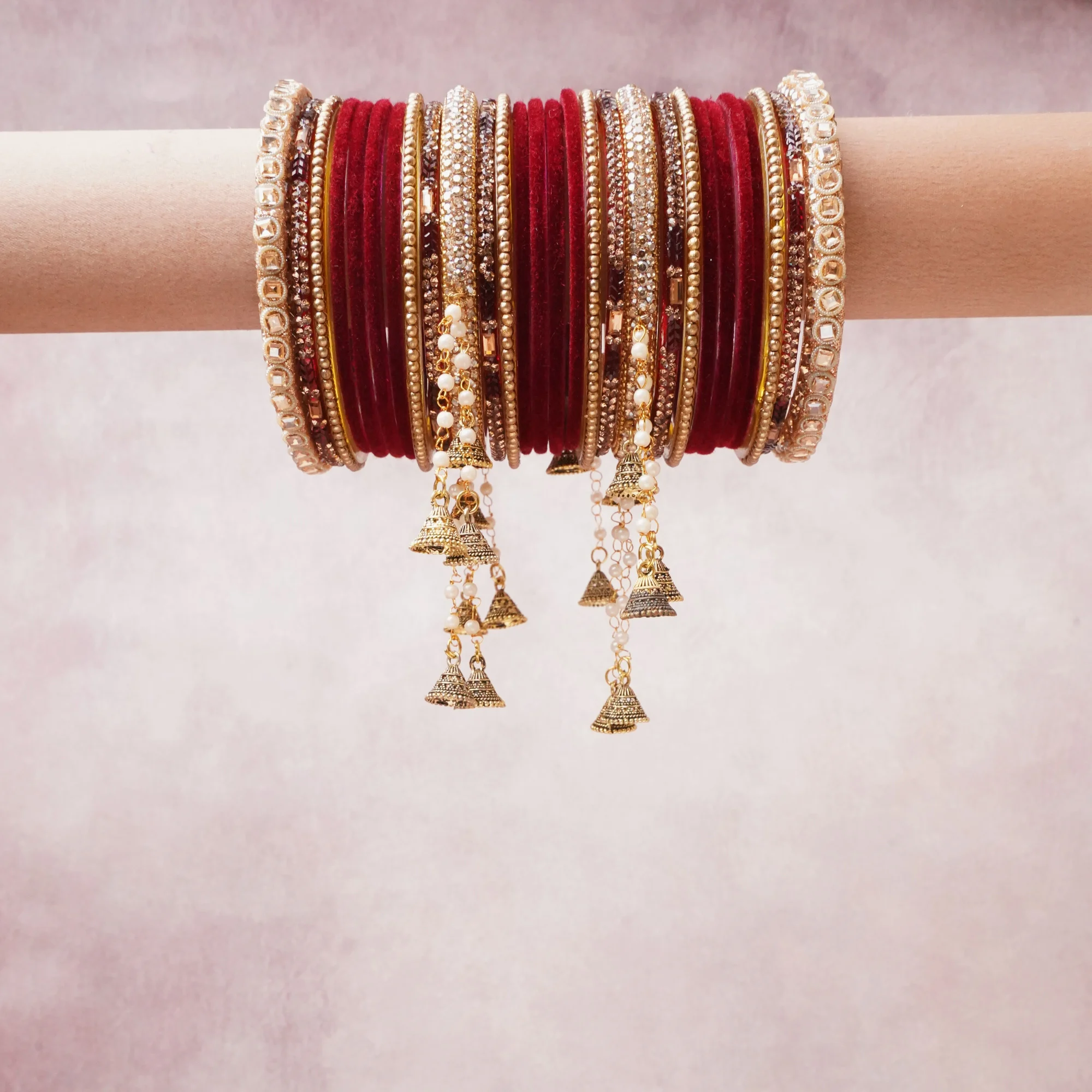 A majestic deep red set, complemented by gold, champagne, ivory featuring glass bangles, gold-tone metal, pearl beads.
Rich, ceremonial, and designed to be passed through generations.