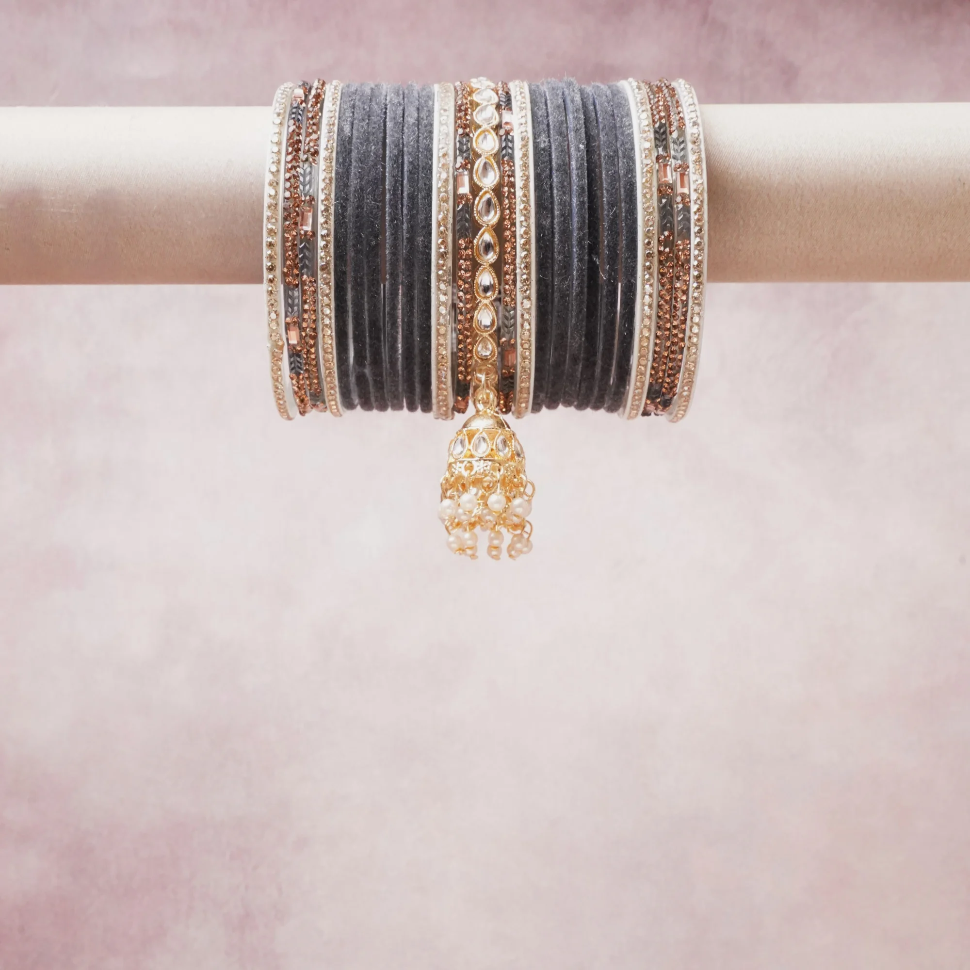 A commanding charcoal gray anchors this beautiful set, enriched with accents of Rose Gold, Ivory, Champagne Gold that add depth and dimension.

Featuring a striking composition of velvet, metal, crystals, pearl beads, this set carries intricate craftsmanship and strong presence. Grand in form, it is created for moments that deserve to be marked.