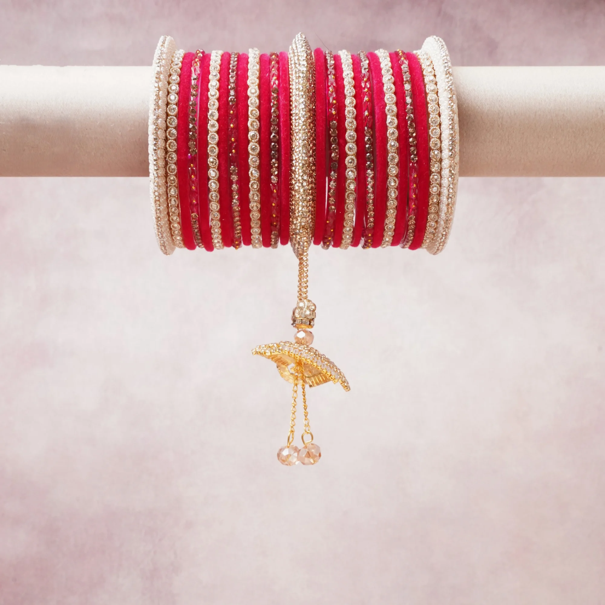 A commanding Fuchsia anchors this beautiful set, enriched with accents of Gold, White, Blush Pink that add depth and dimension.

Featuring a striking composition of silk thread, rhinestones, gold-tone metal, this set carries intricate craftsmanship and strong presence. Grand in form, it is created for moments that deserve to be marked.