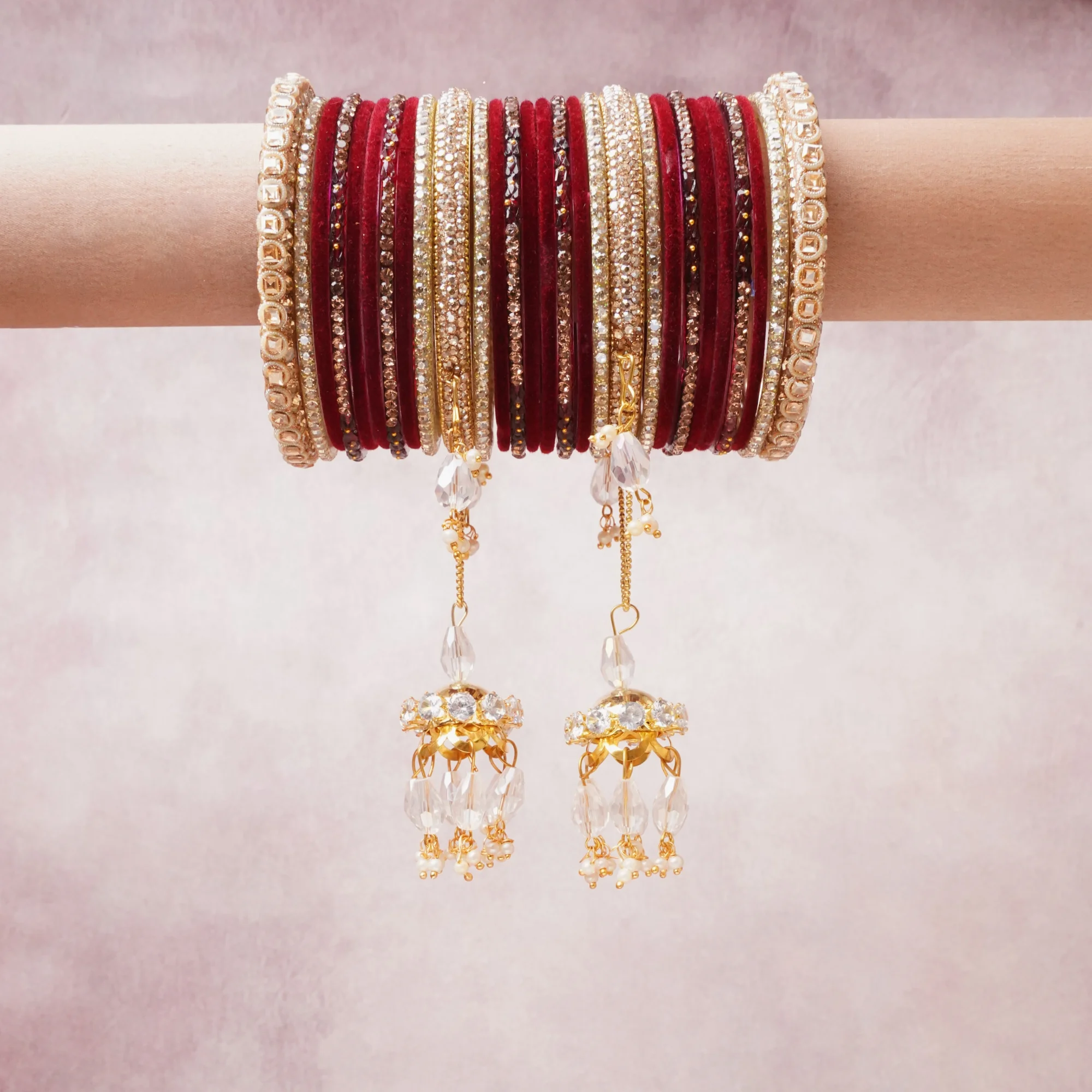 A majestic ruby red set, complemented by gold, clear crystal, champagne featuring glass bangles, metal alloy, crystal embellishments.
Rich, ceremonial, and designed to be passed through generations.