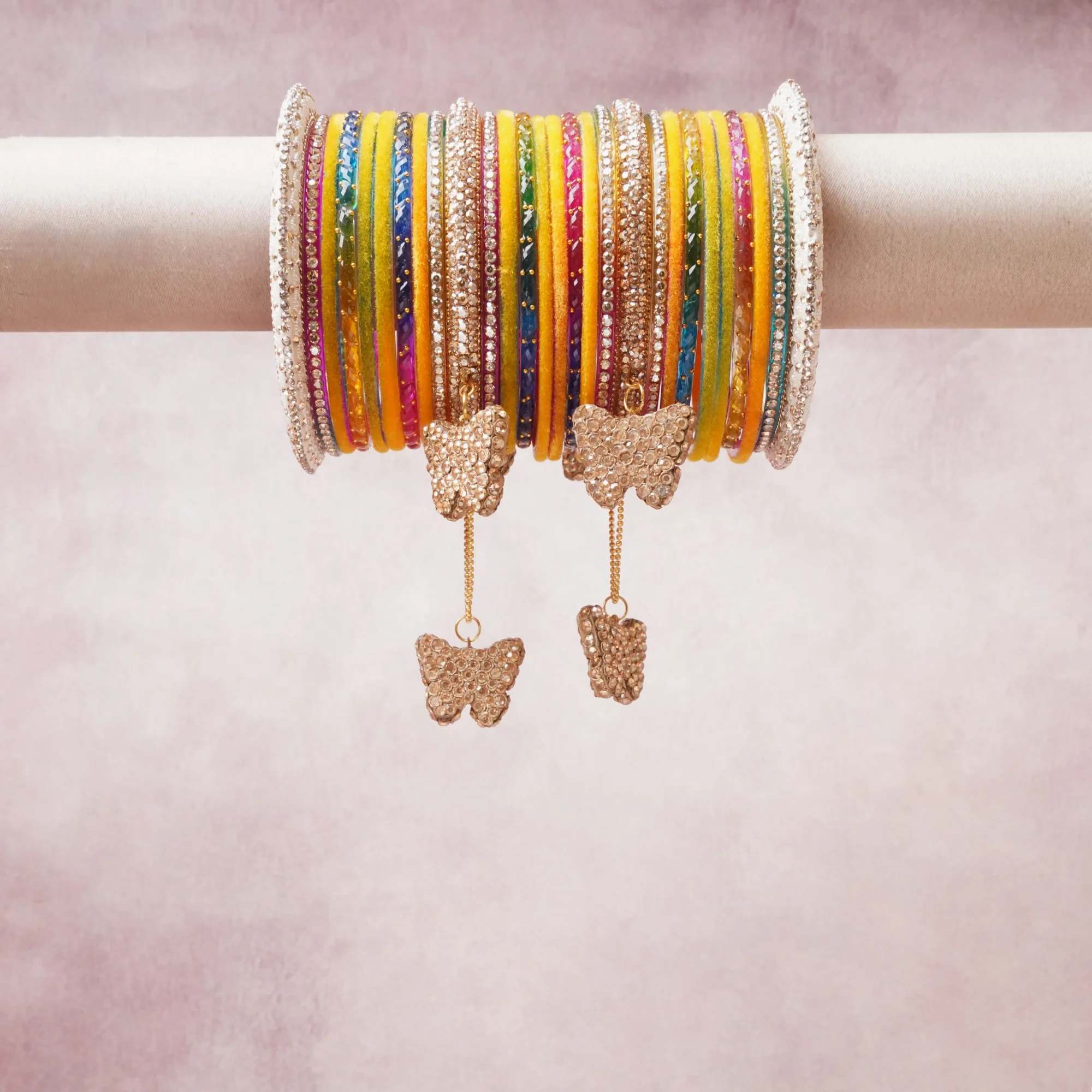 A majestic yellow set, complemented by gold, pink, blue featuring glass bangles, gold-tone metal, rhinestones.
Rich, ceremonial, and designed to be passed through generations.