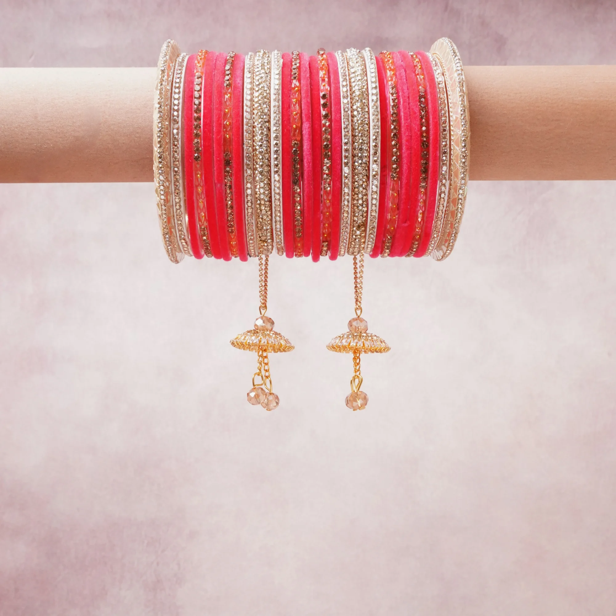 A commanding Hot Pink anchors this beautiful set, enriched with accents of Clear Crystal, Gold, Ivory that add depth and dimension.

Featuring a striking composition of glass bangles, rhinestone metal, gold-tone alloy, this set carries intricate craftsmanship and strong presence. Grand in form, it is created for moments that deserve to be marked.