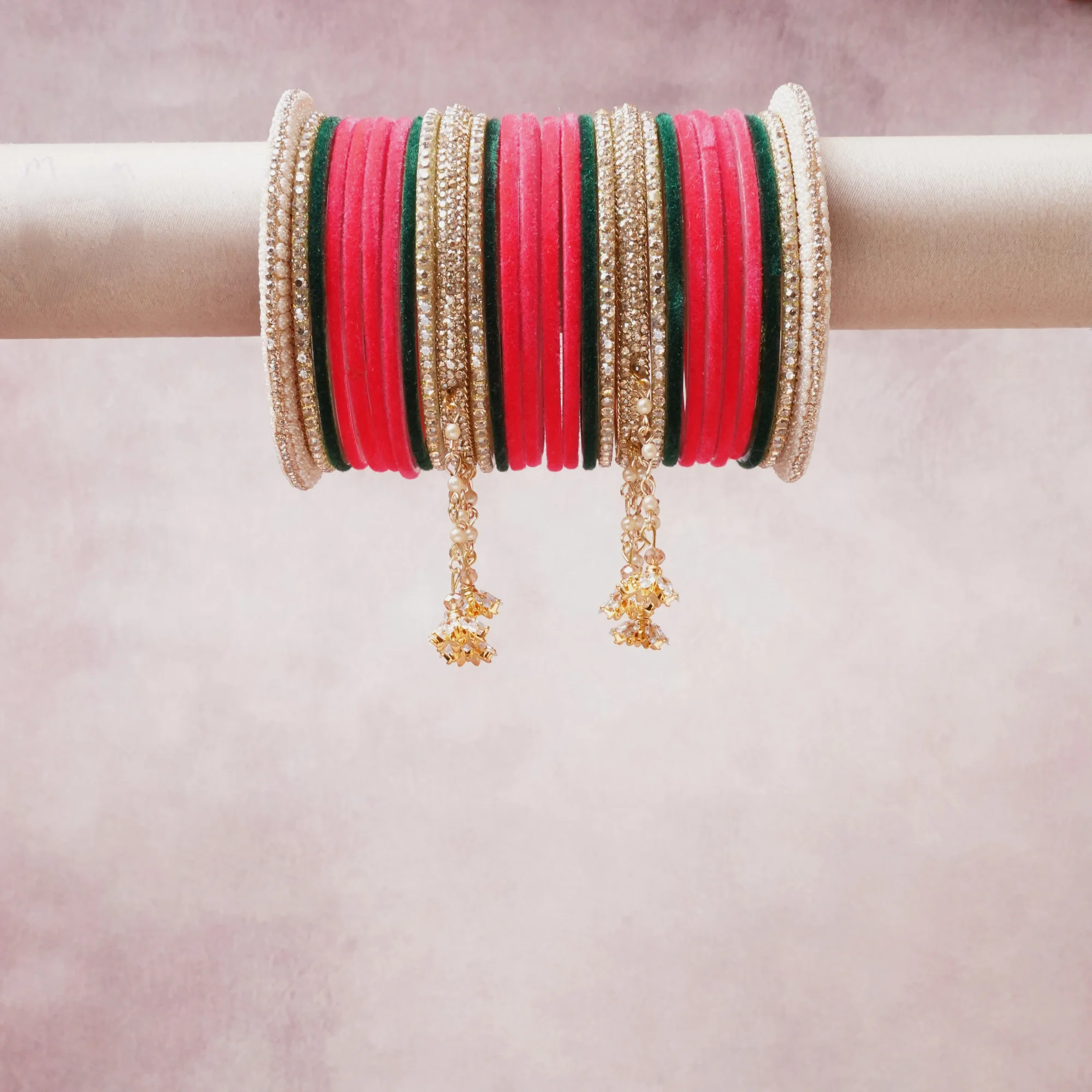 A commanding Hot Pink anchors this beautiful set, enriched with accents of Emerald Green, Gold, Ivory that add depth and dimension.

Featuring a striking composition of Fabric Bangles, Gold-tone Metal, Rhinestones, this set carries intricate craftsmanship and strong presence. Grand in form, it is created for moments that deserve to be marked.