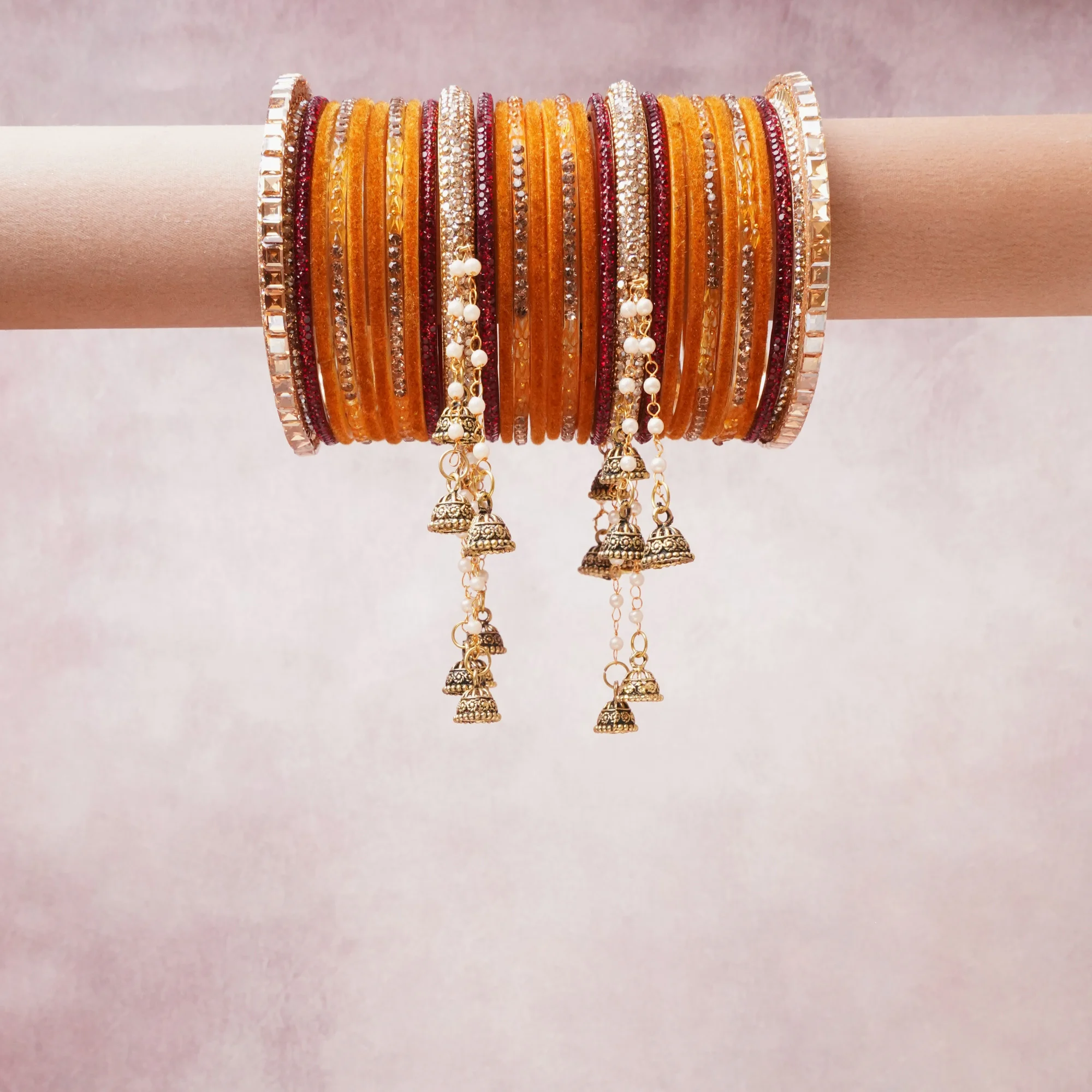 A majestic Amber Orange set, complemented by Gold featuring Glass Bangle, Gold-Plated Metal, Pearls.
Rich, ceremonial, and designed to be passed through generations.