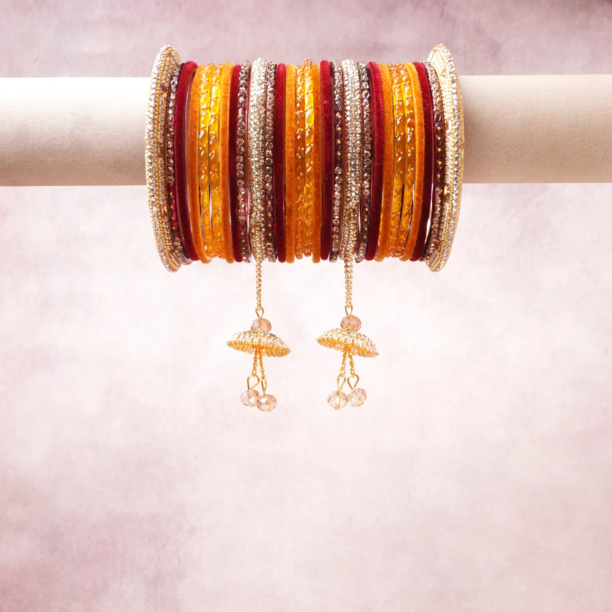 A majestic gold set, complemented by ruby red, amber orange, crystal white featuring glass bangles, rhinestone, gold-tone metal.
Rich, ceremonial, and designed to be passed through generations.