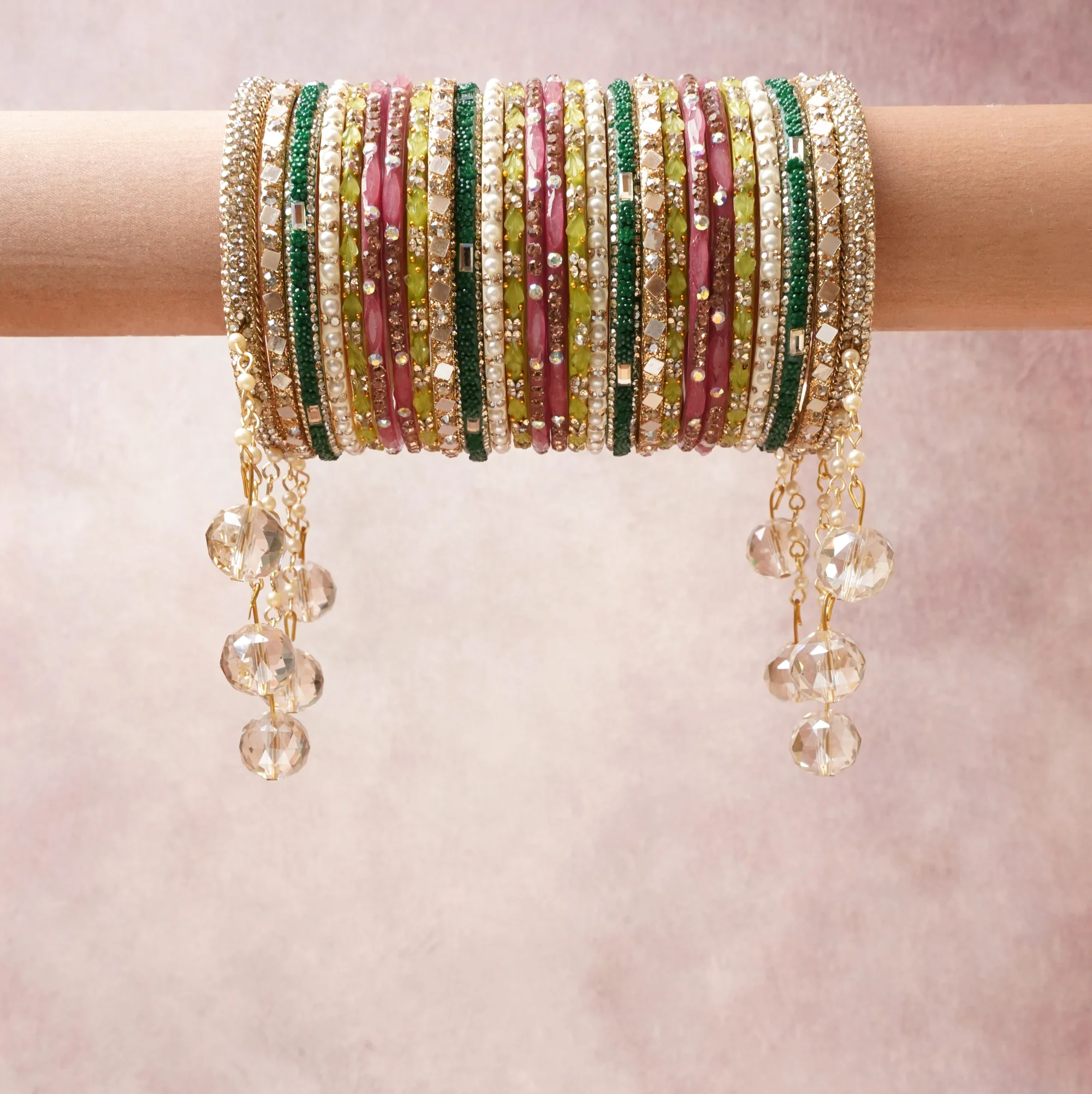 A commanding gold anchors this beautiful set, enriched with accents of white, green, pink that add depth and dimension.

Featuring a striking composition of crystal beads, faux pearls, metal, this set carries intricate craftsmanship and strong presence. Grand in form, it is created for moments that deserve to be marked.