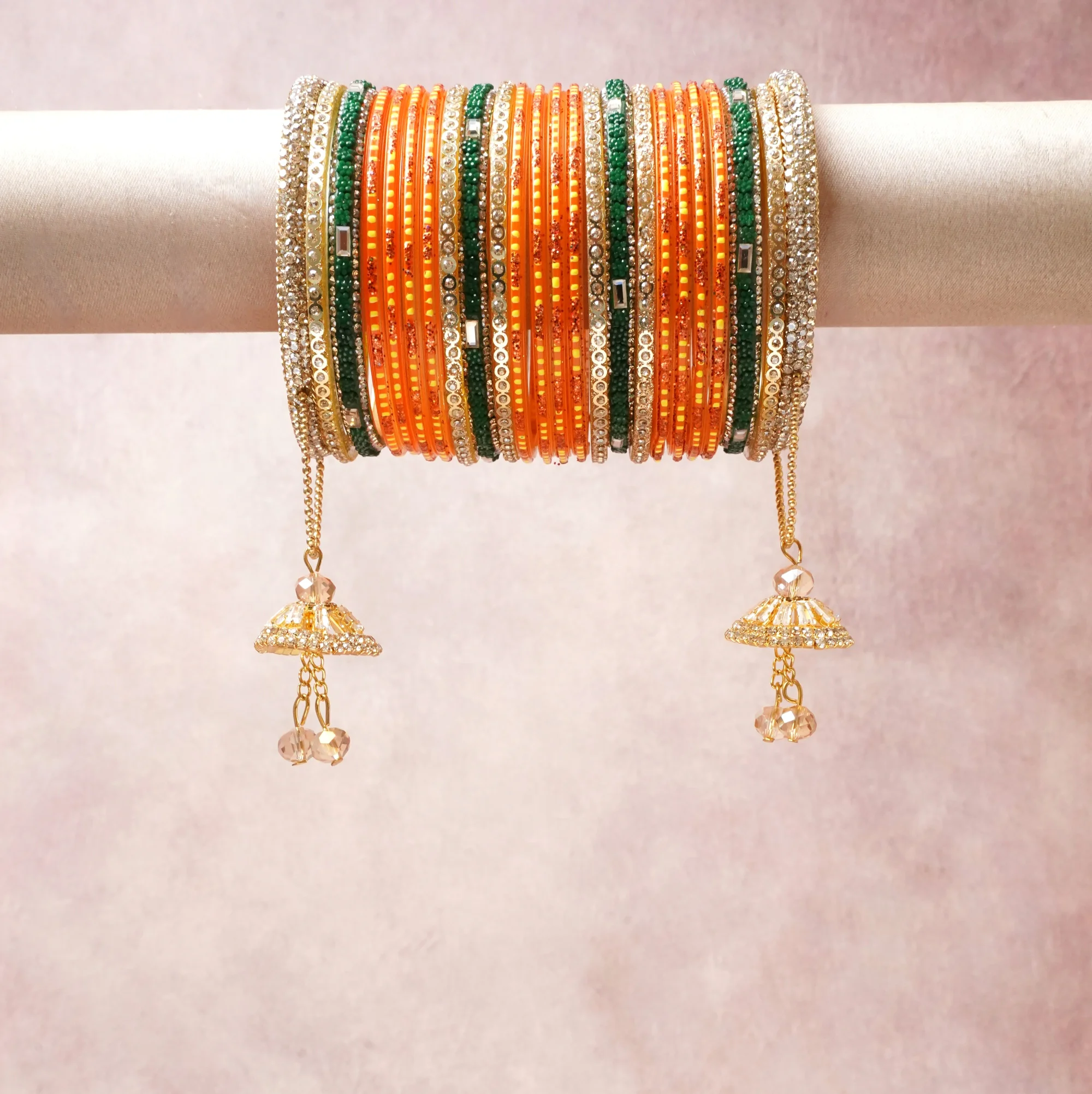 A commanding Orange anchors this beautiful set, enriched with accents of Gold, Green, White that add depth and dimension.

Featuring a striking composition of Glass Beads, Rhinestones, Gold Tone Metal, this set carries intricate craftsmanship and strong presence. Grand in form, it is created for moments that deserve to be marked.