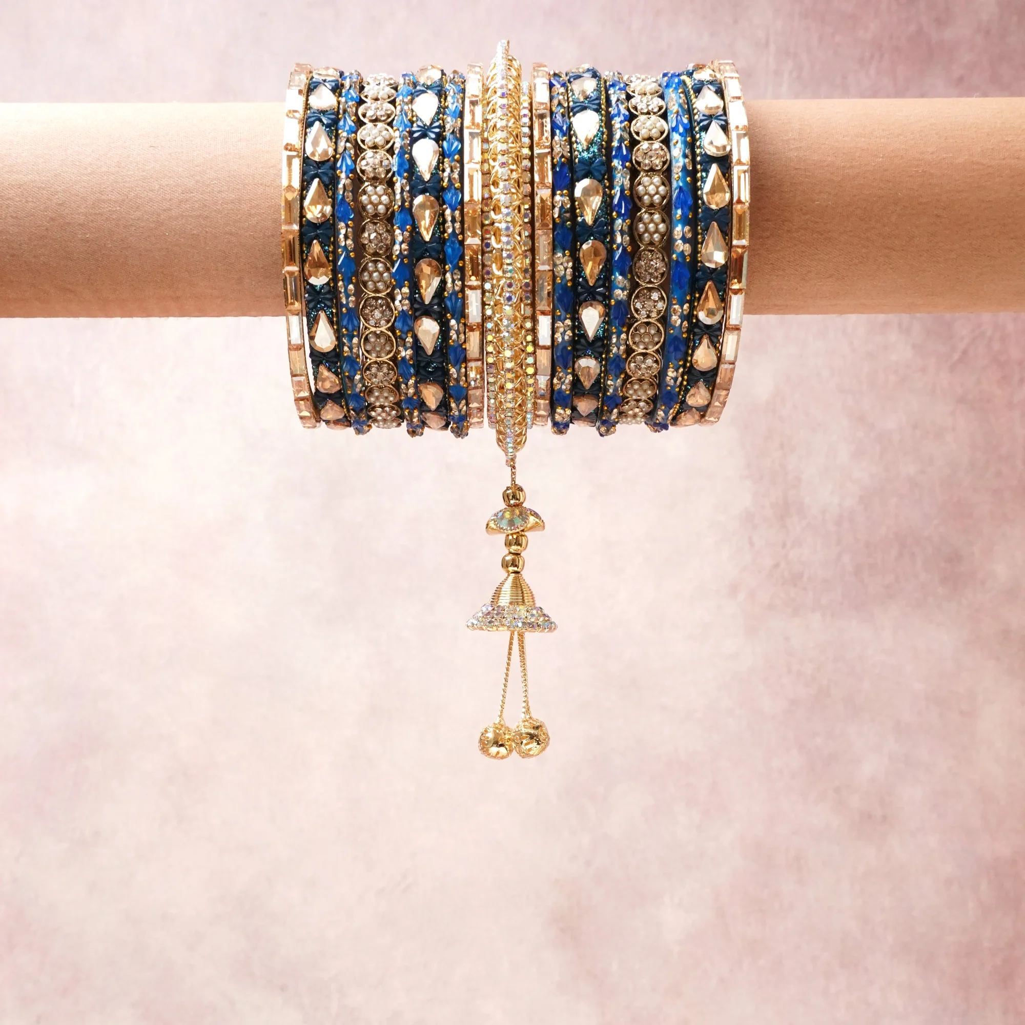 A commanding Gold anchors this beautiful set, enriched with accents of royal blue, clear crystal, champagne gold that add depth and dimension.

Featuring a striking composition of gold-tone metal, rhinestones, crystals, this set carries intricate craftsmanship and strong presence. Grand in form, it is created for moments that deserve to be marked.