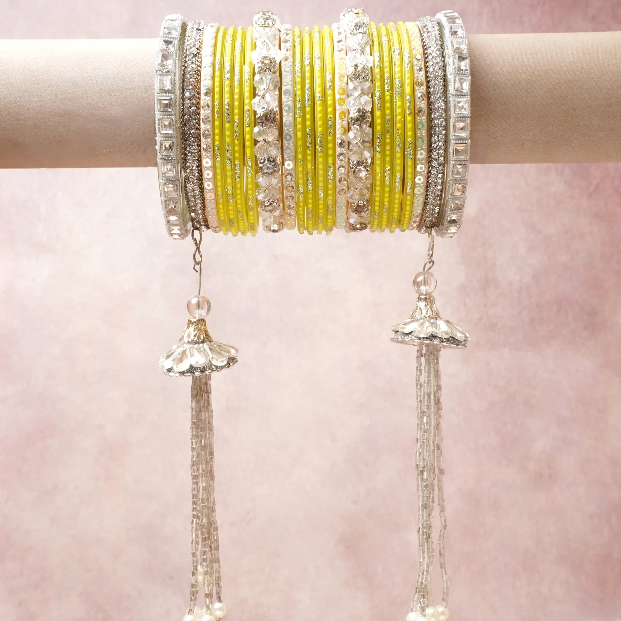 A commanding Yellow anchors this beautiful set, enriched with accents of Silver, White, Clear that add depth and dimension.

Featuring a striking composition of Glass bangles, rhinestones, metal, this set carries intricate craftsmanship and strong presence. Grand in form, it is created for moments that deserve to be marked.