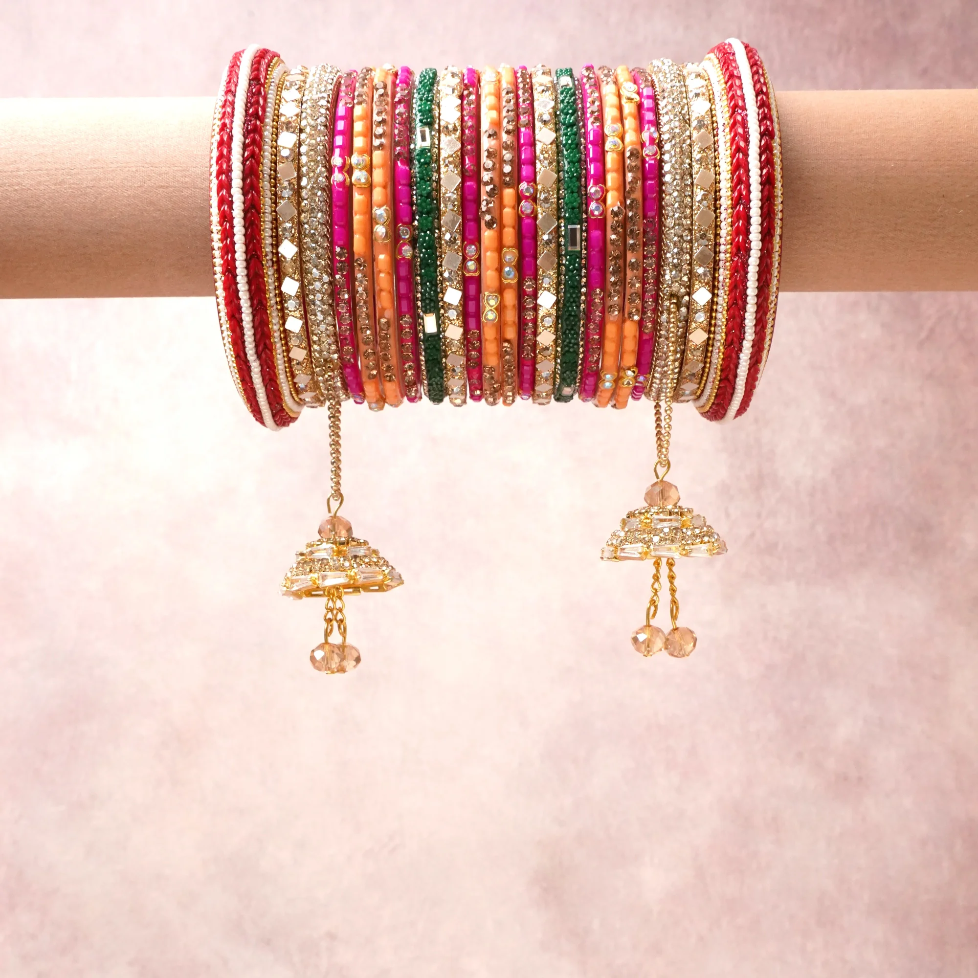 A commanding gold anchors this beautiful set, enriched with accents of red, pink, orange that add depth and dimension.

Featuring a striking composition of glass beads, rhinestones, metal, this set carries intricate craftsmanship and strong presence. Grand in form, it is created for moments that deserve to be marked.