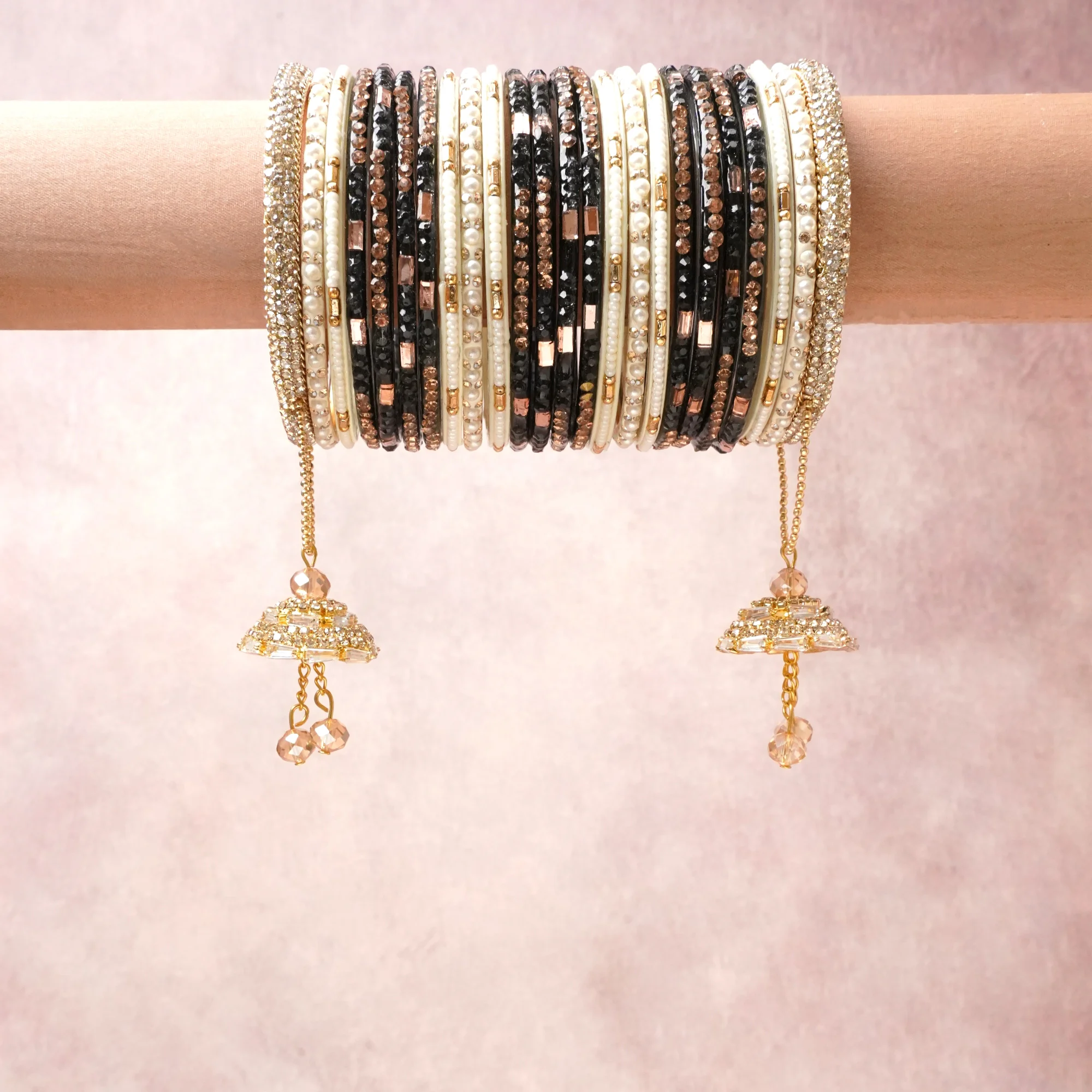 A commanding Gold anchors this beautiful set, enriched with accents of Black, Ivory, Rose Gold that add depth and dimension.

Featuring a striking composition of Crystal, Pearl, Gold-tone metal, this set carries intricate craftsmanship and strong presence. Grand in form, it is created for moments that deserve to be marked.