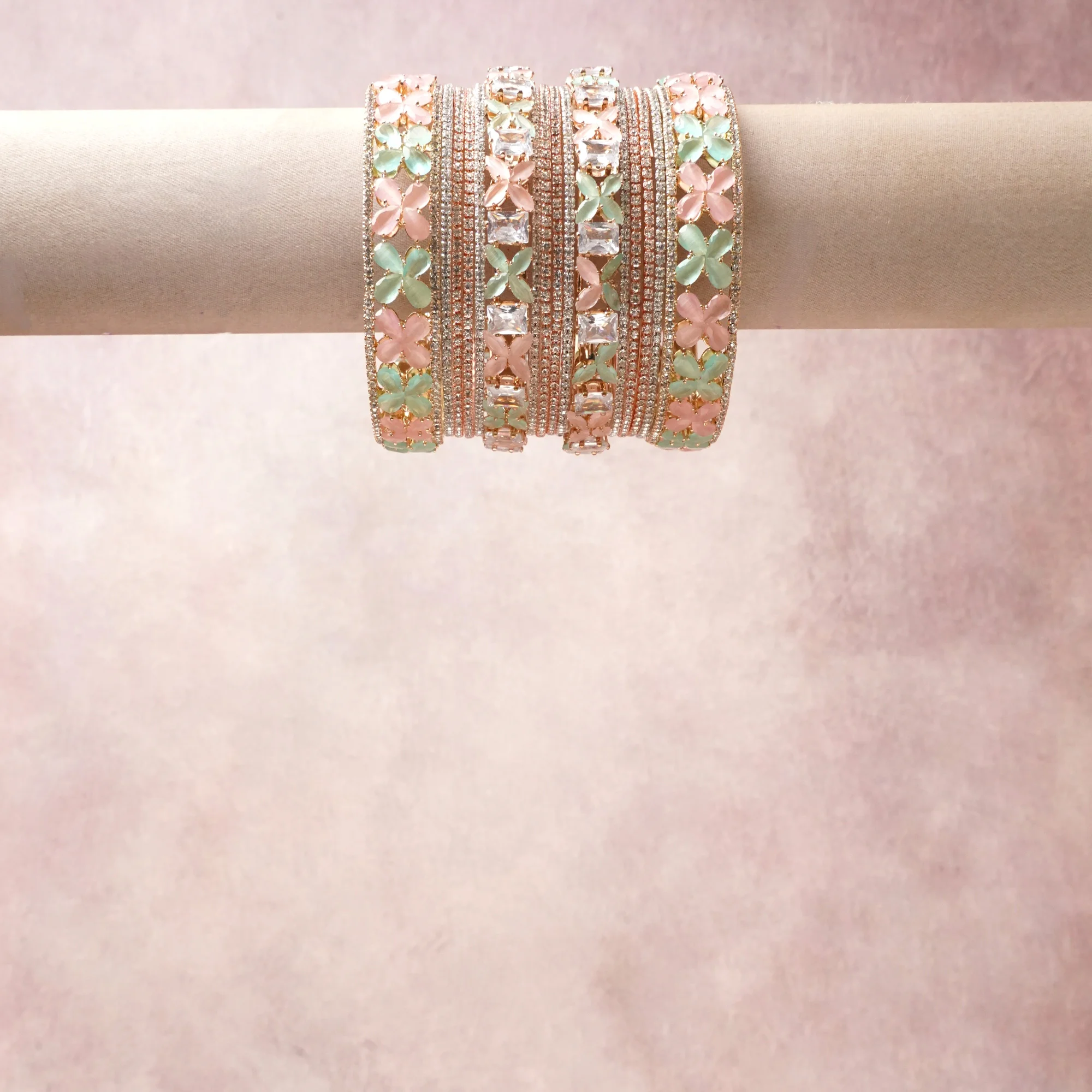 A commanding rose gold anchors this beautiful set, enriched with accents of pastel pink, mint green, clear crystal that add depth and dimension.

Featuring a striking composition of metal, rhinestone, enamel, this set carries intricate craftsmanship and strong presence. Grand in form, it is created for moments that deserve to be marked.