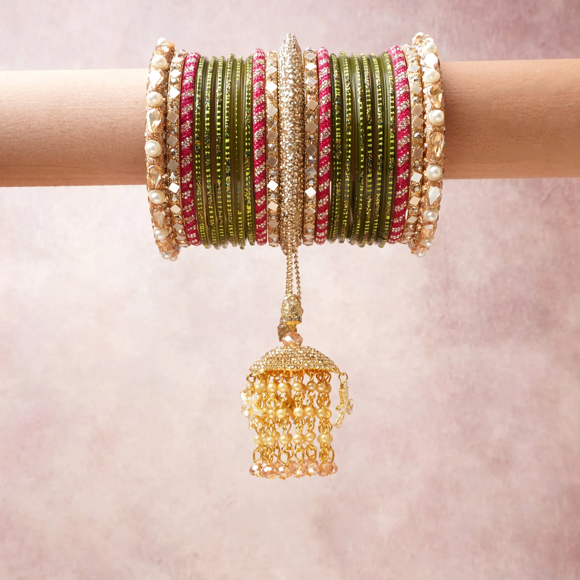 A commanding gold anchors this beautiful set, enriched with accents of olive green, hot pink, ivory that add depth and dimension.

Featuring a striking composition of metal, rhinestones, faux pearls, this set carries intricate craftsmanship and strong presence. Grand in form, it is created for moments that deserve to be marked.